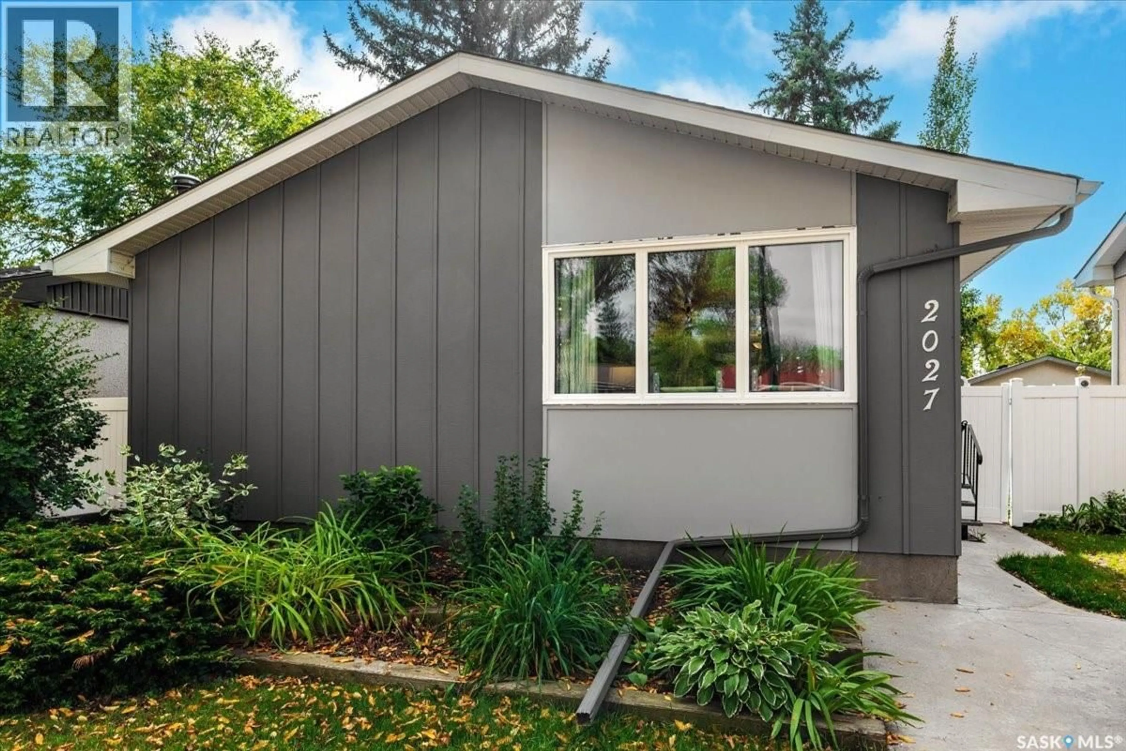 Home with vinyl exterior material, street for 2027 DEWDNEY AVENUE, Regina Saskatchewan S4N4C3