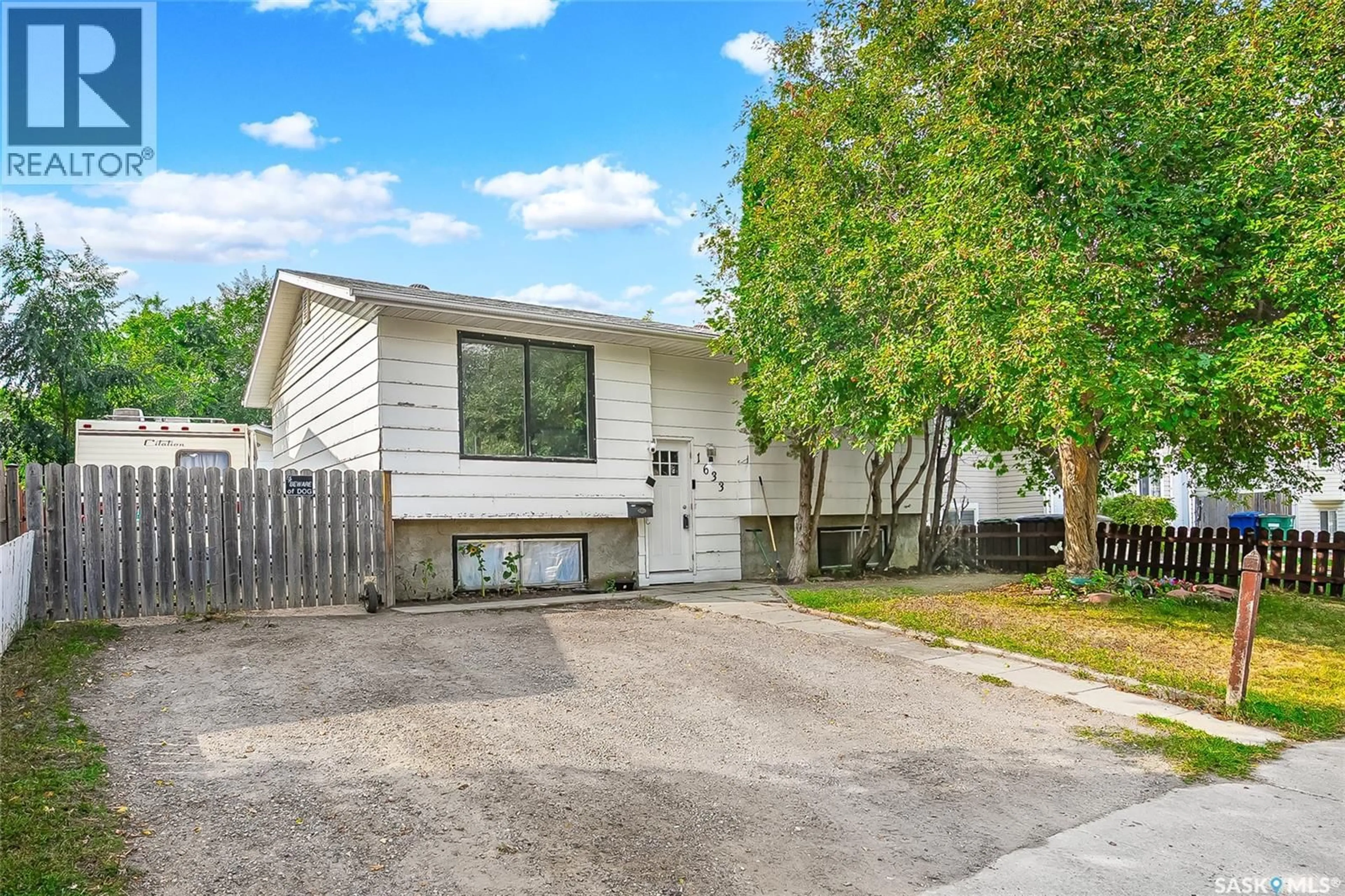 Home with vinyl exterior material, street for 1633 B AVENUE, Saskatoon Saskatchewan S7L1H2