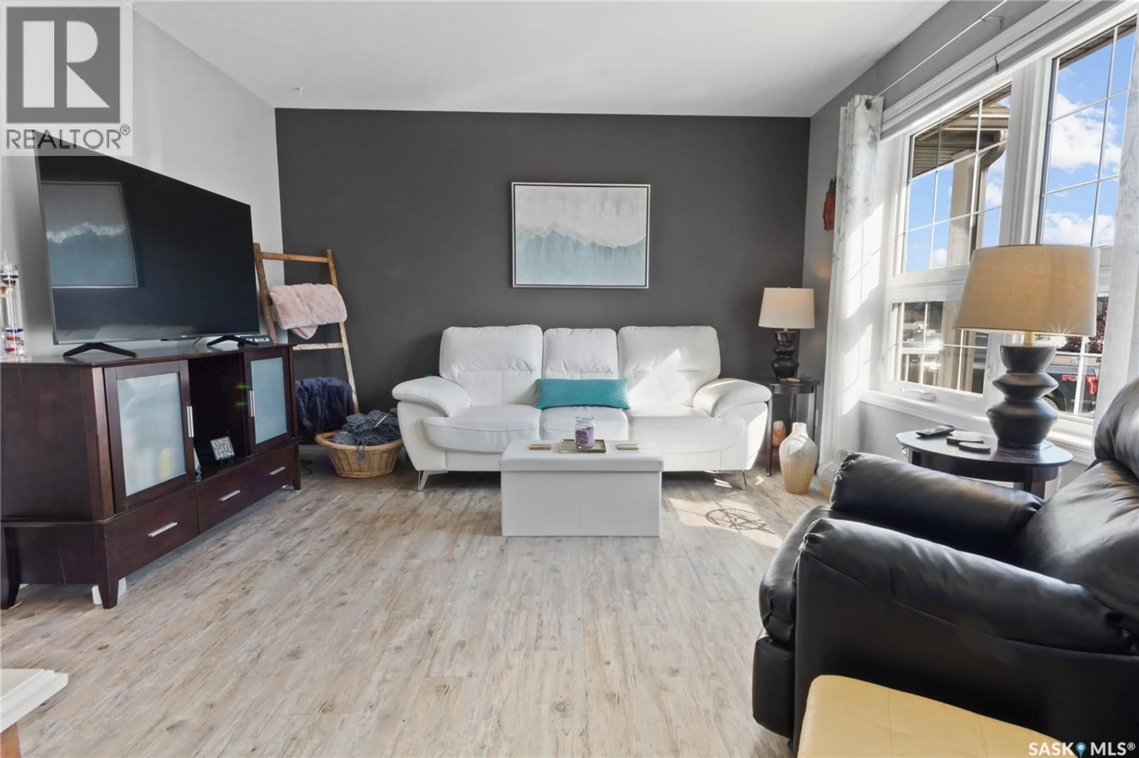 Living room with furniture, wood/laminate floor for S - 118 700 2ND AVENUE, Martensville Saskatchewan S0K2T0