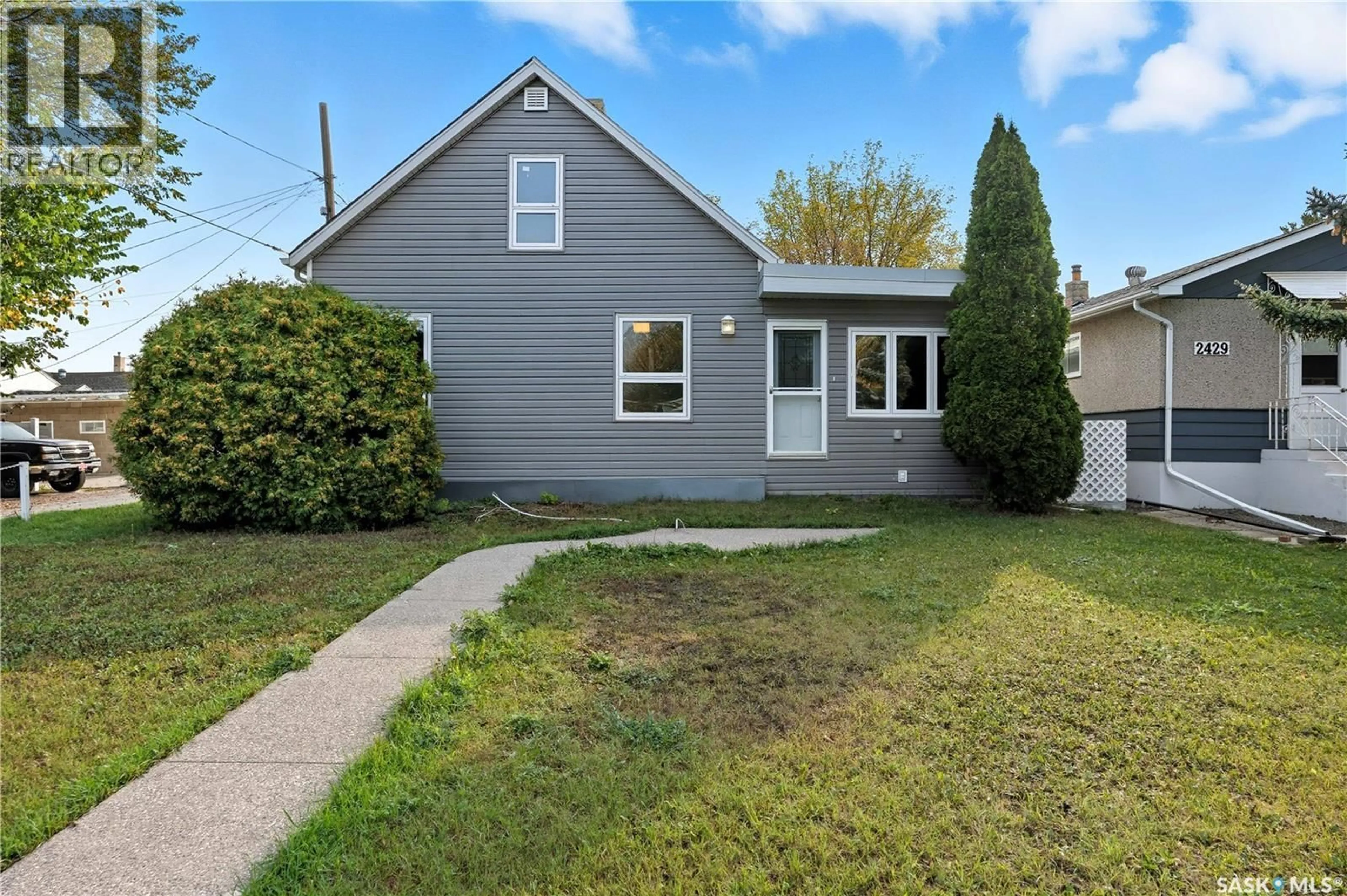 Home with vinyl exterior material, street for 2425 EDGAR STREET, Regina Saskatchewan S4N3L4