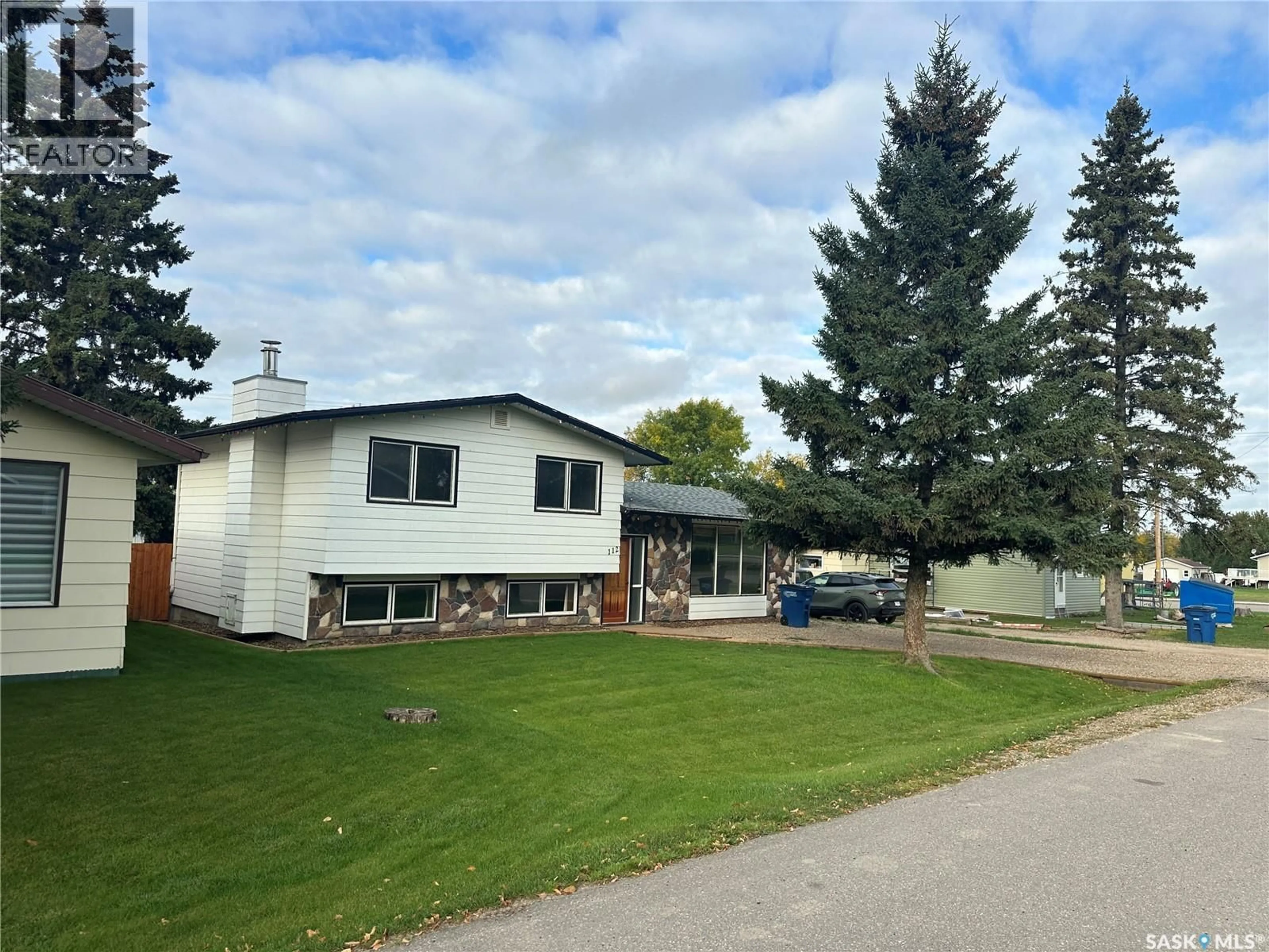 Home with vinyl exterior material, street for 112 5TH AVENUE, Big River Saskatchewan S0J0E0