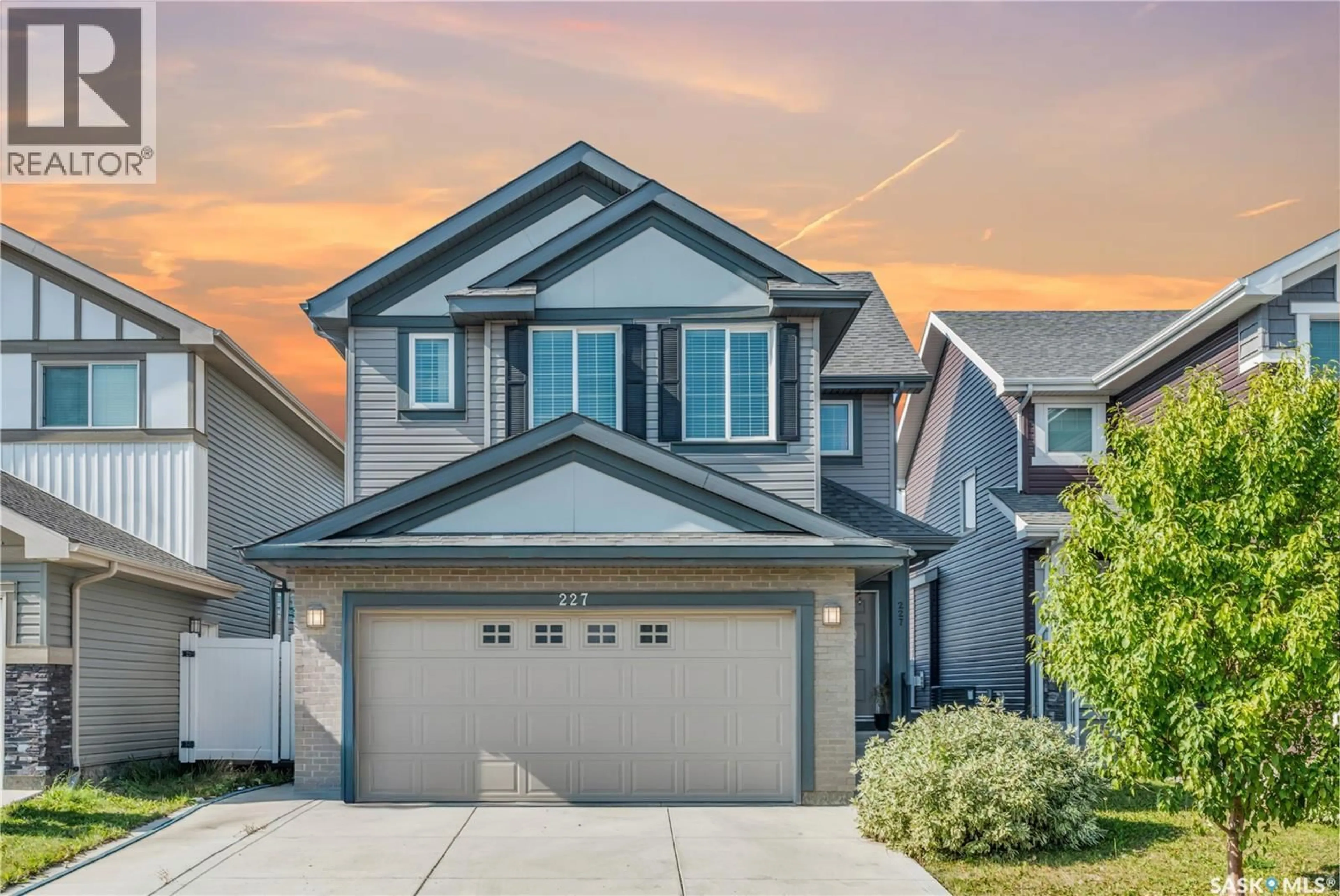 Home with vinyl exterior material, street for 227 DAGNONE LANE, Saskatoon Saskatchewan S7V0R1