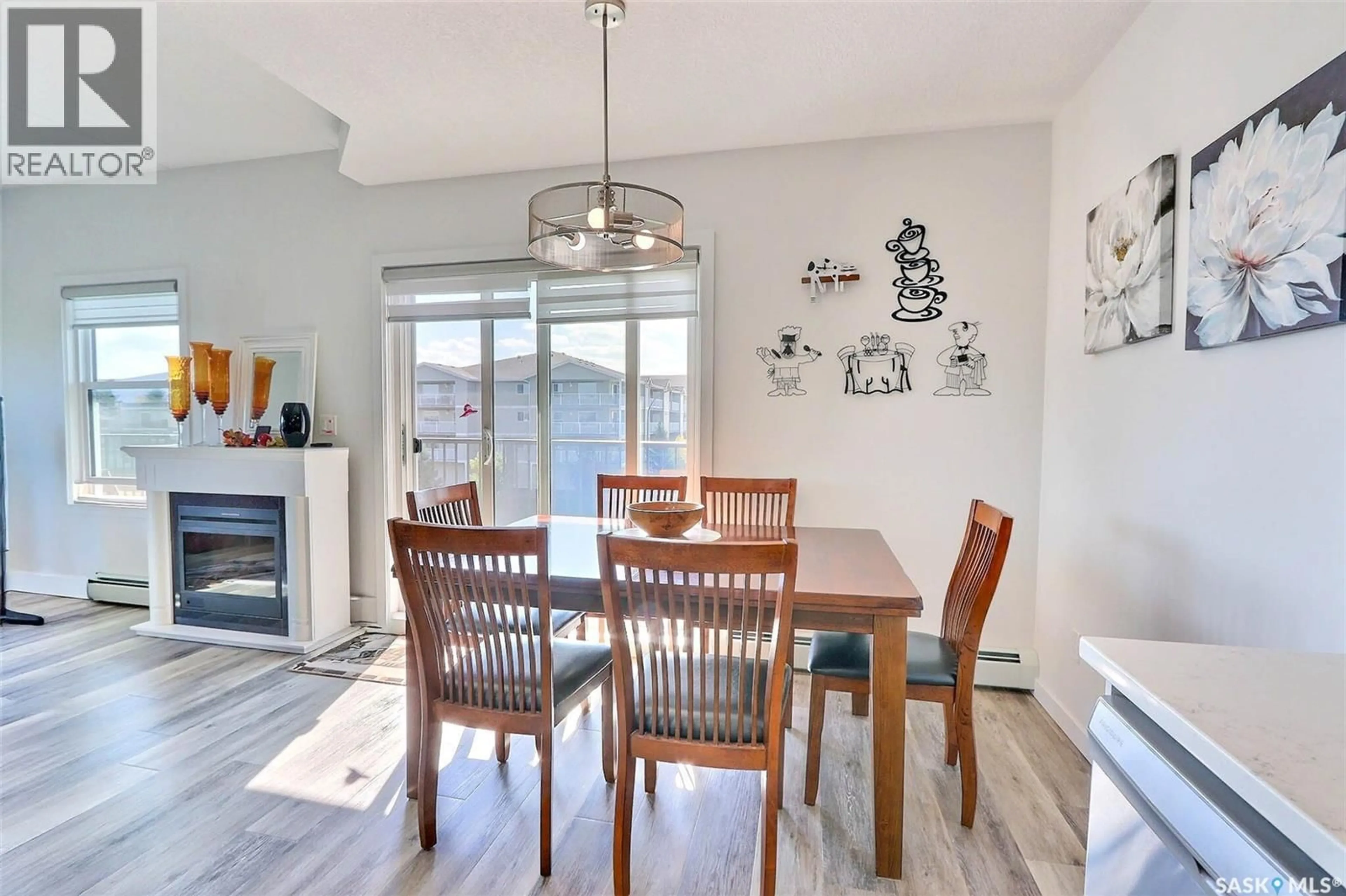 Dining room, wood/laminate floor for 303 - 2641 WOODBRIDGE DRIVE, Prince Albert Saskatchewan S6V0A9