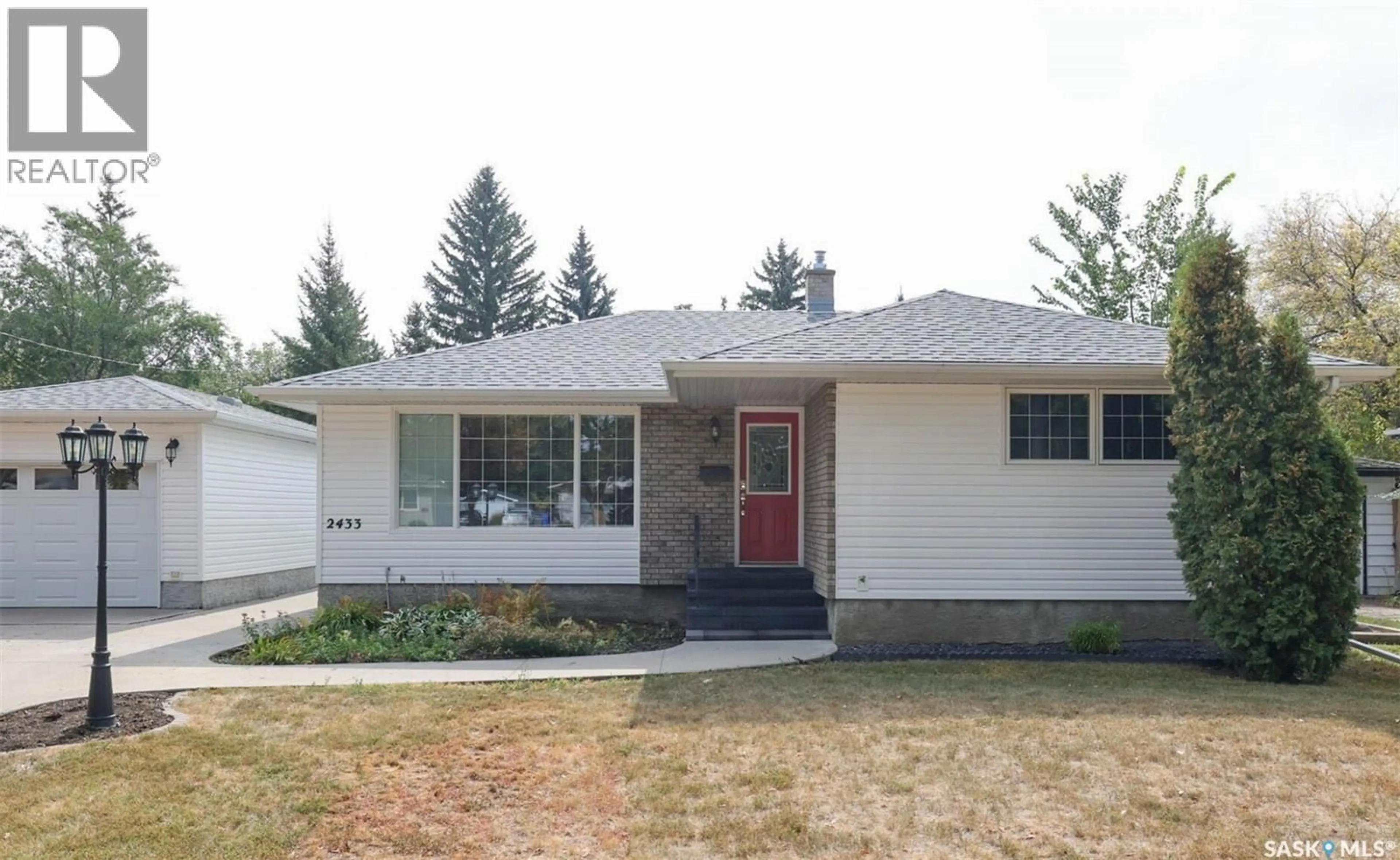 Home with vinyl exterior material, street for 2433 GORDON ROAD, Regina Saskatchewan S4S4M4