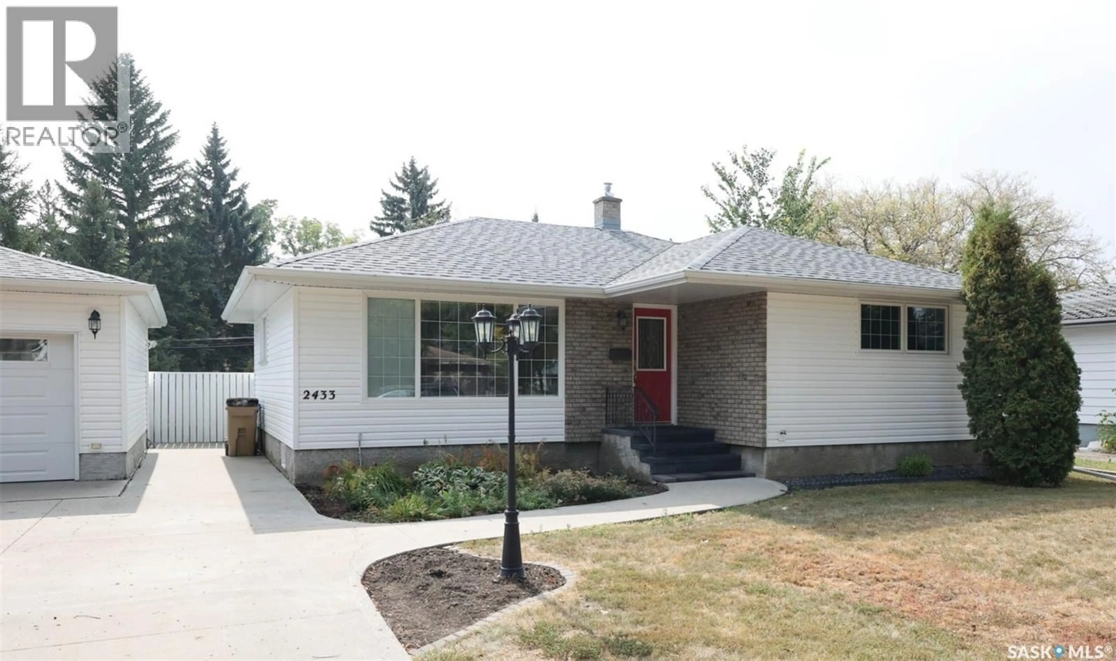 Home with brick exterior material, street for 2433 GORDON ROAD, Regina Saskatchewan S4S4M4