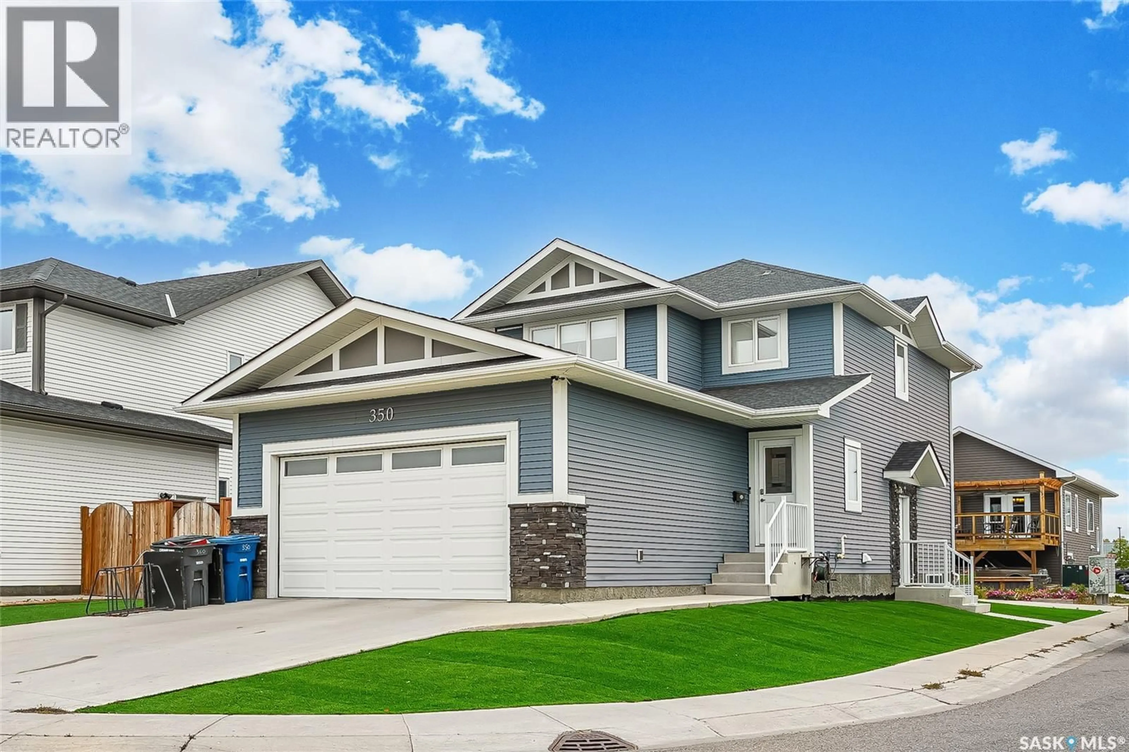 Home with vinyl exterior material, street for 350 HASSARD CLOSE, Saskatoon Saskatchewan S7L4Y7