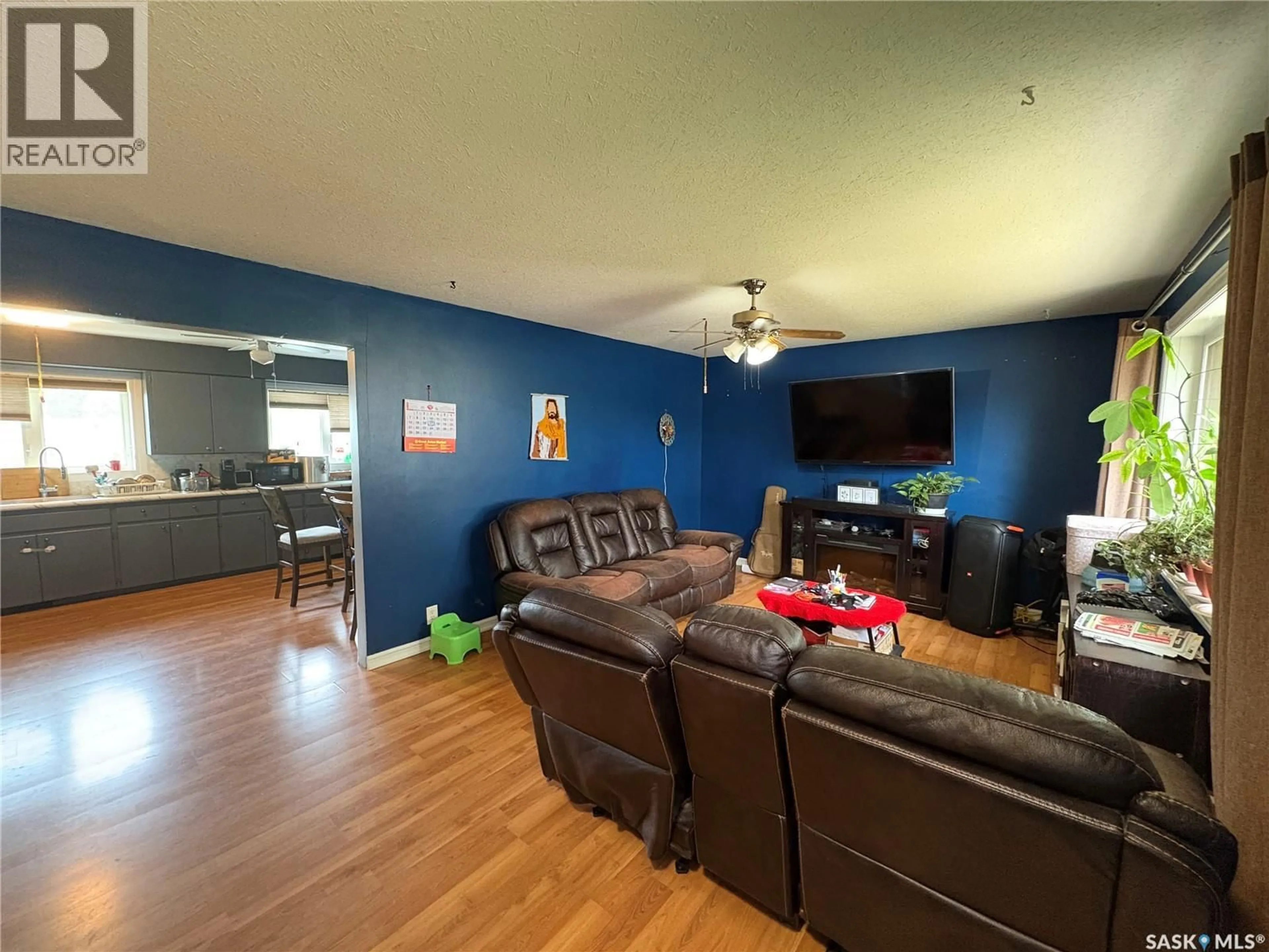 Living room with furniture, wood/laminate floor for 168 TORONTO STREET, Regina Saskatchewan S4R1L7