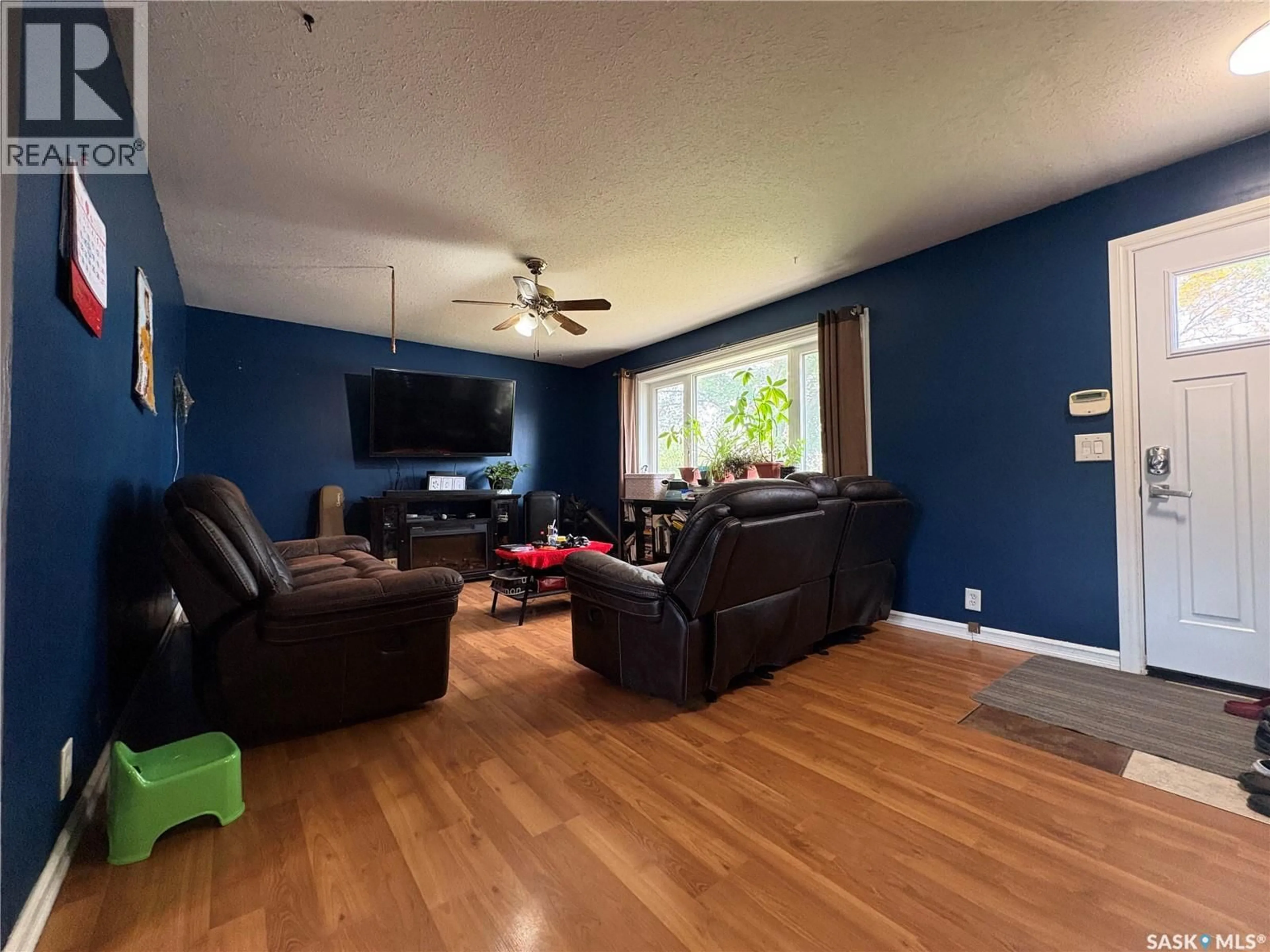 Living room with furniture, wood/laminate floor for 168 TORONTO STREET, Regina Saskatchewan S4R1L7