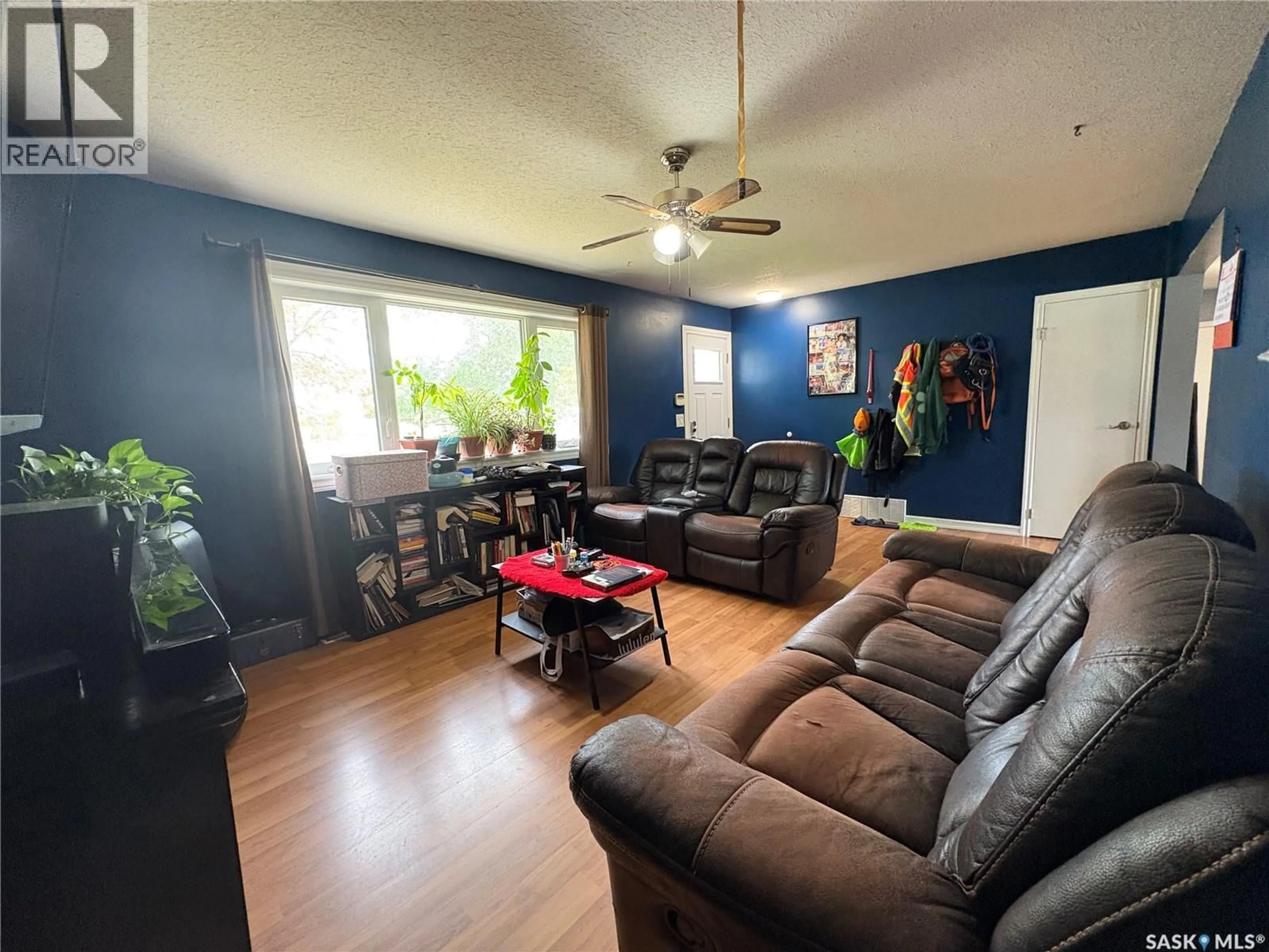 Living room with furniture, wood/laminate floor for 168 TORONTO STREET, Regina Saskatchewan S4R1L7
