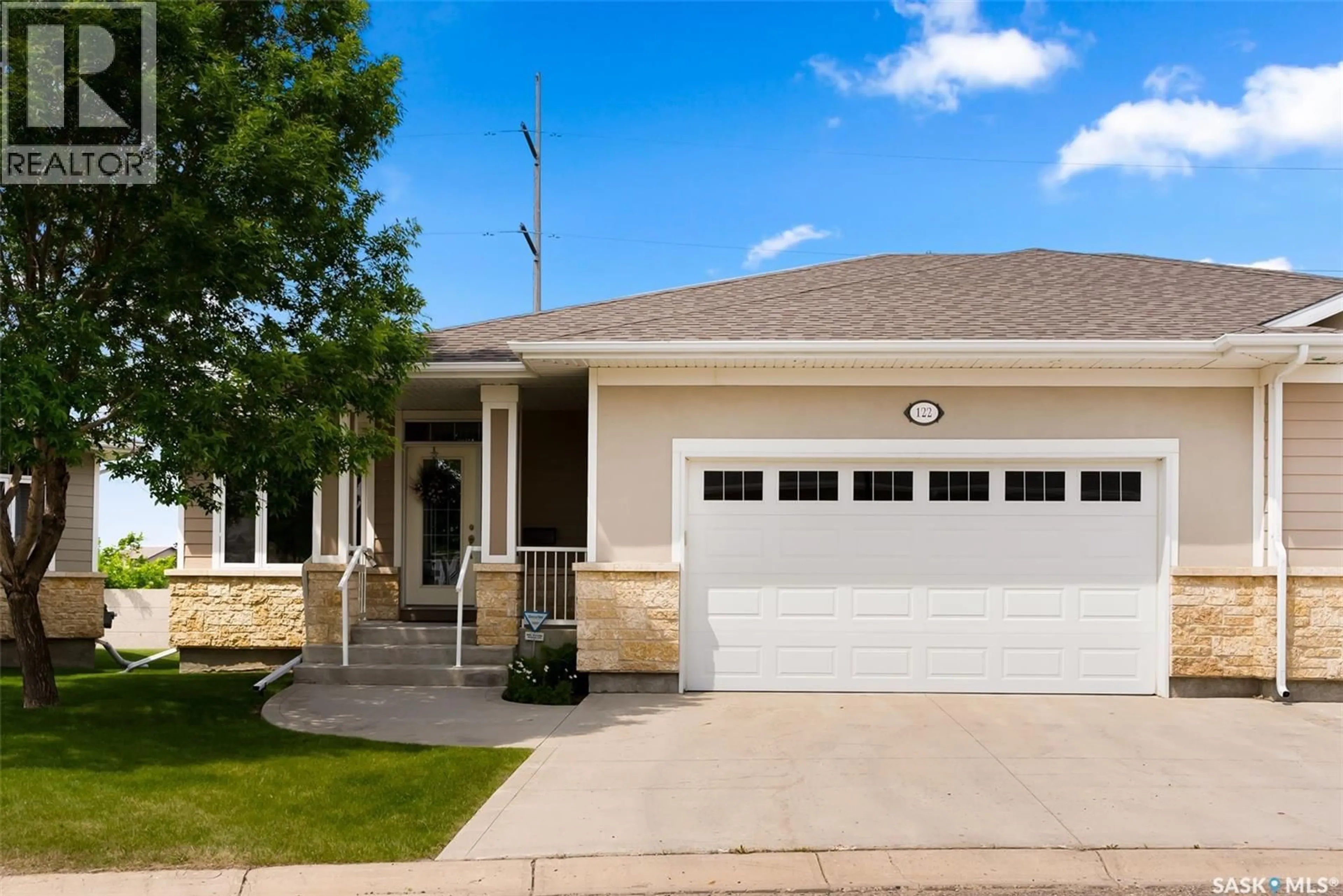 Home with vinyl exterior material, street for 122 WINTERGREENE LANE, Regina Saskatchewan S4S0A7
