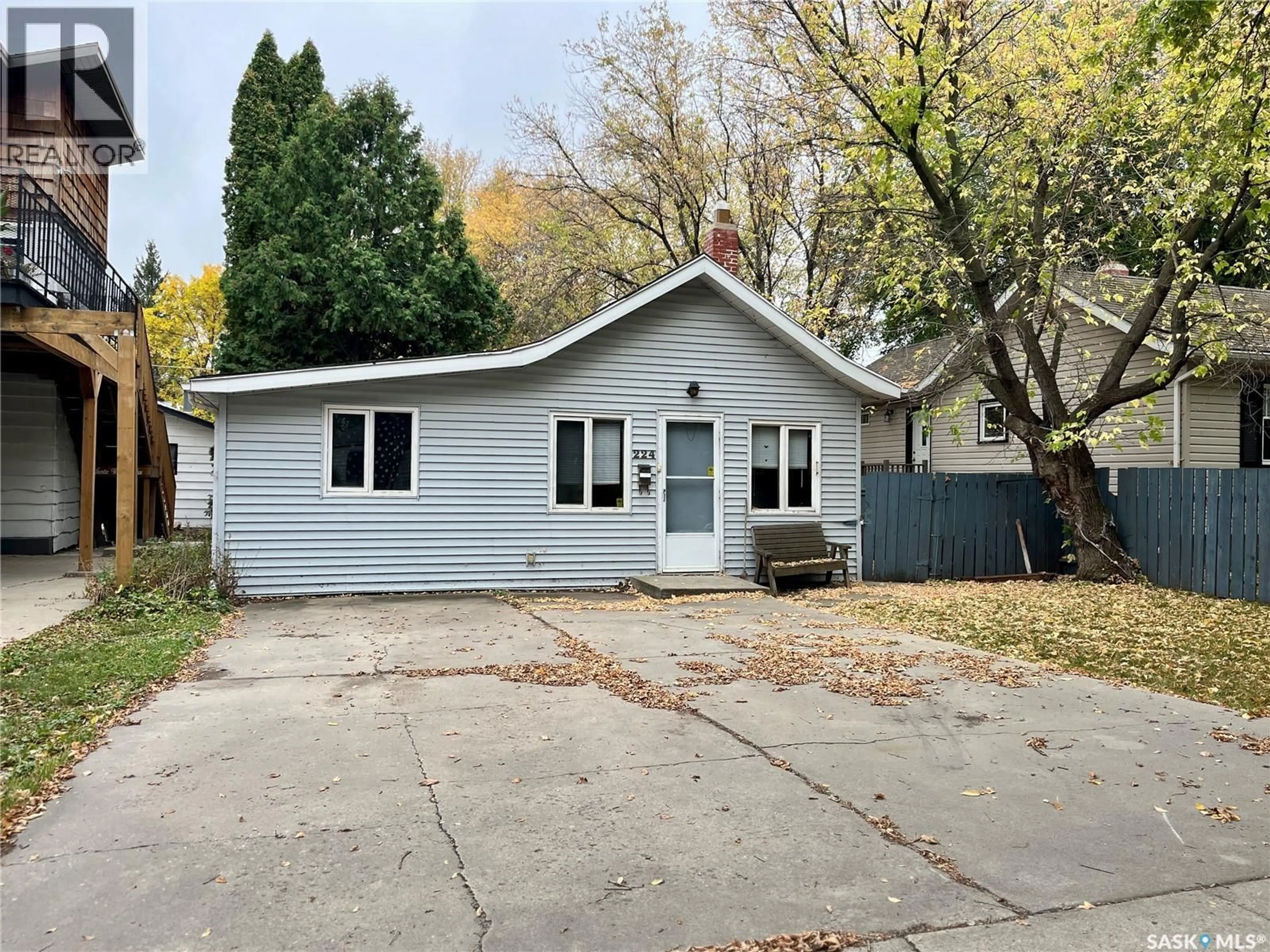 Home with vinyl exterior material, street for 224 ELM STREET, Saskatoon Saskatchewan S7J0G7