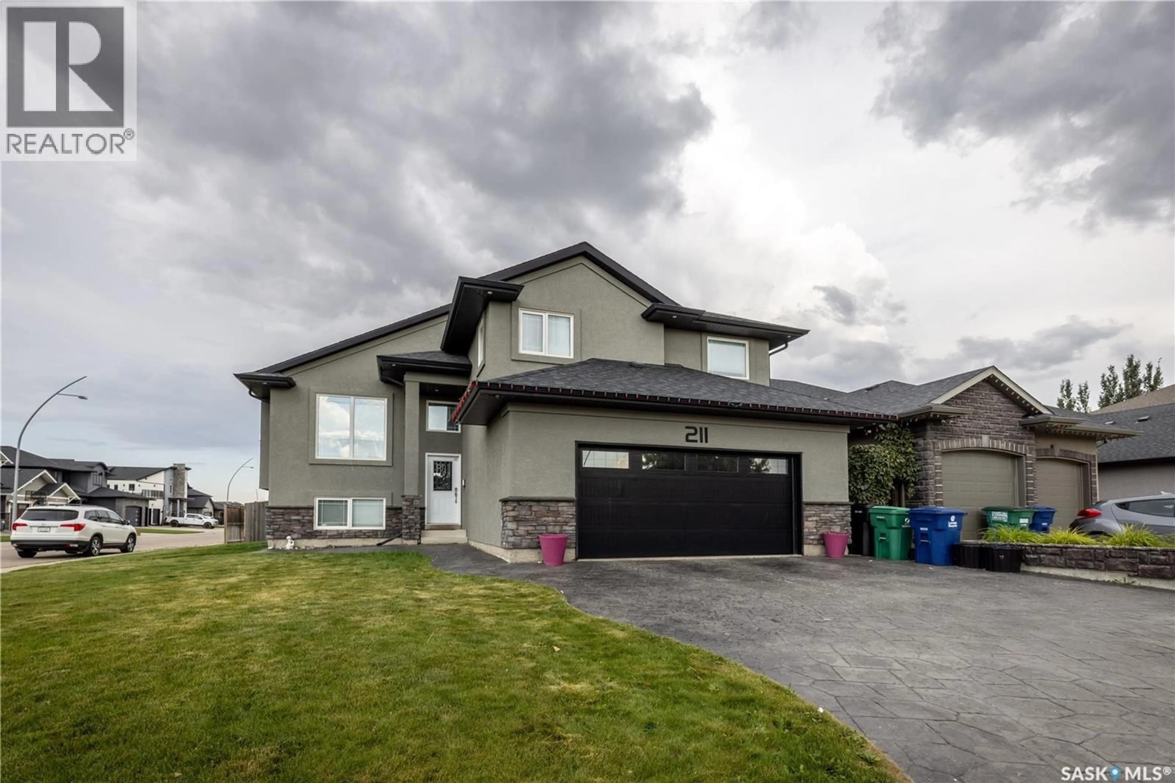Home with vinyl exterior material, street for 211 SAUER CRESCENT, Saskatoon Saskatchewan S7S1L9