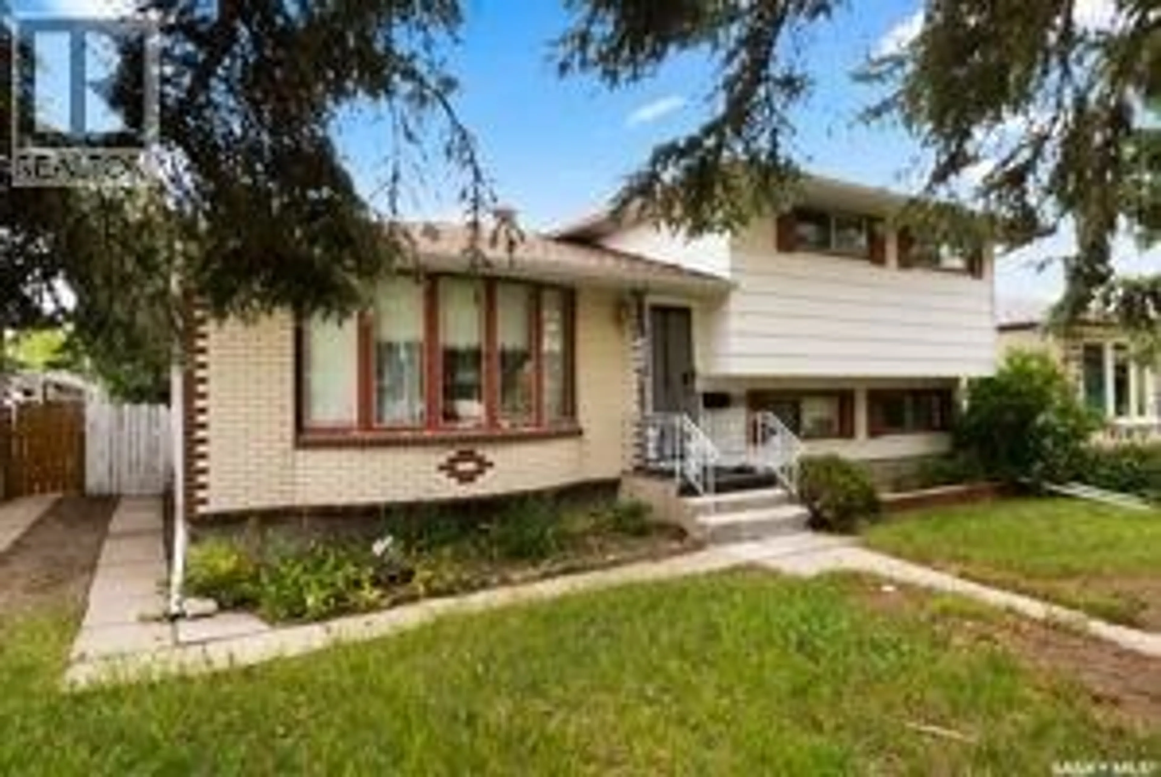Home with brick exterior material, street for 1015 12TH AVENUE, Regina Saskatchewan S4N4W1