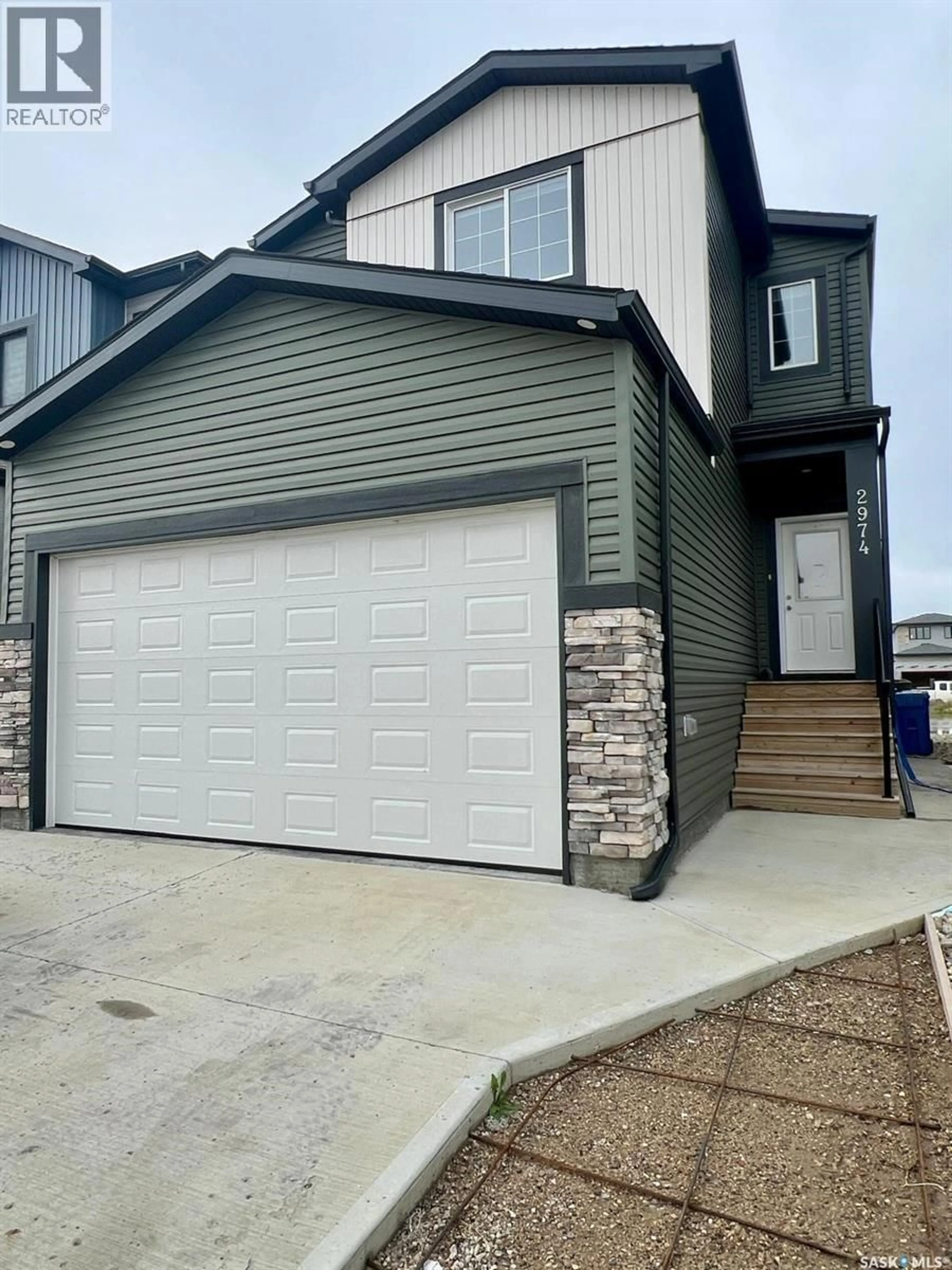 Home with vinyl exterior material, street for 2974 GREEN BROOK ROAD, Regina Saskatchewan S4V3Z6