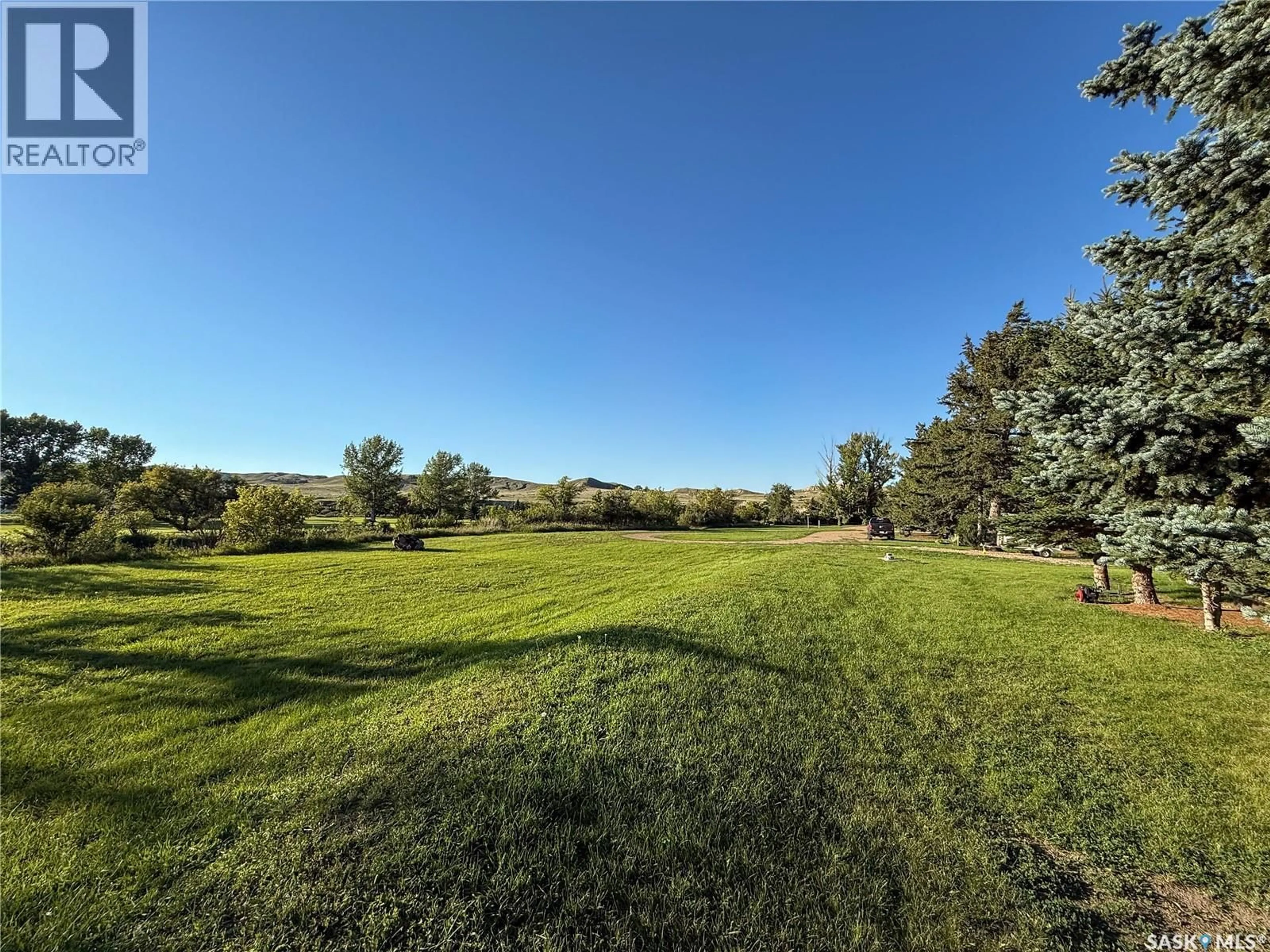 A pic from outside/outdoor area/front of a property/back of a property/a pic from drone, forest/trees view for 223 RIVERSIDE BOULEVARD, Eastend Saskatchewan S0N0T0