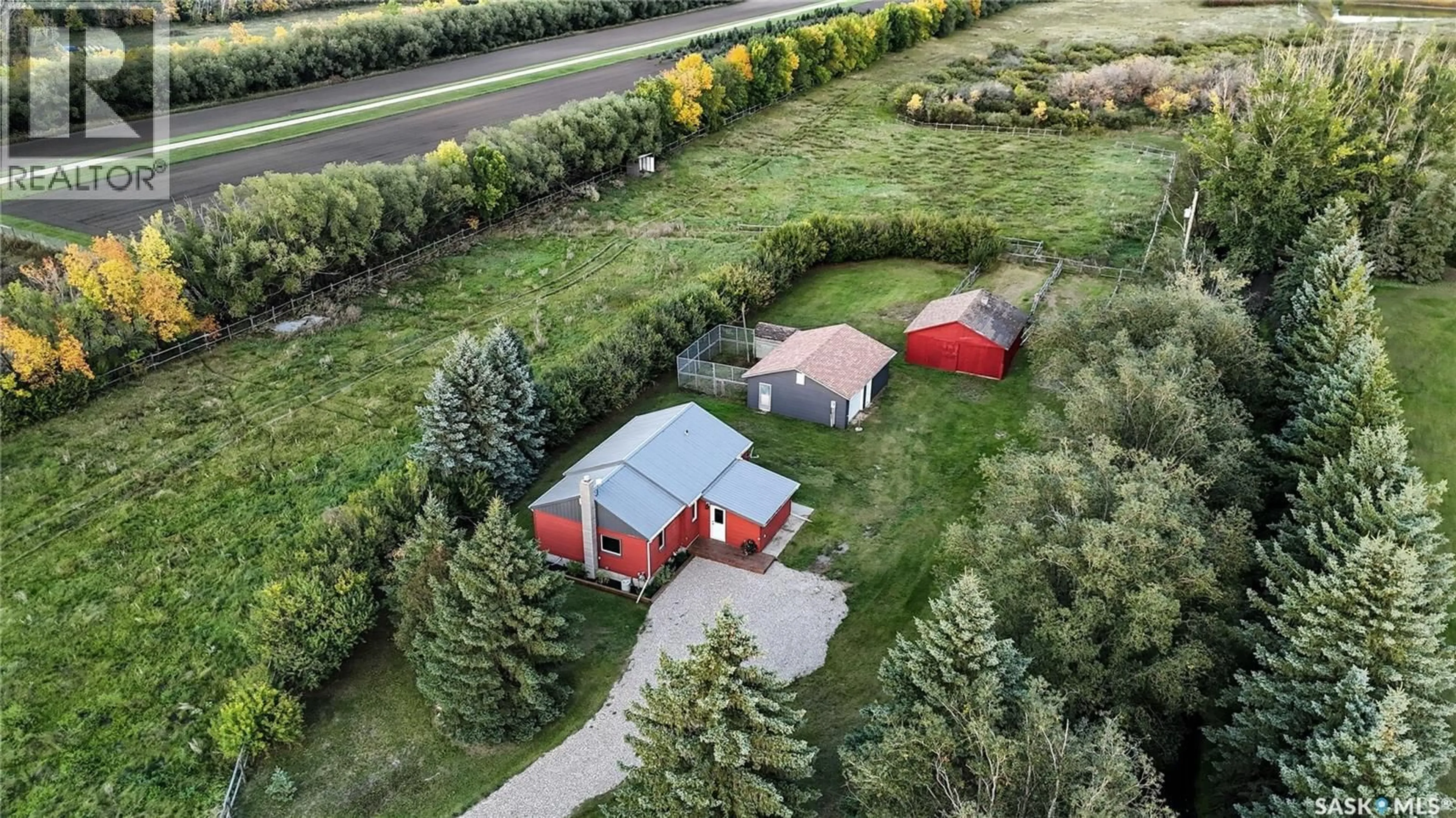 A pic from outside/outdoor area/front of a property/back of a property/a pic from drone, street for WOLLF ACREAGE, Corman Park Rm No. 344 Saskatchewan S0K3A0