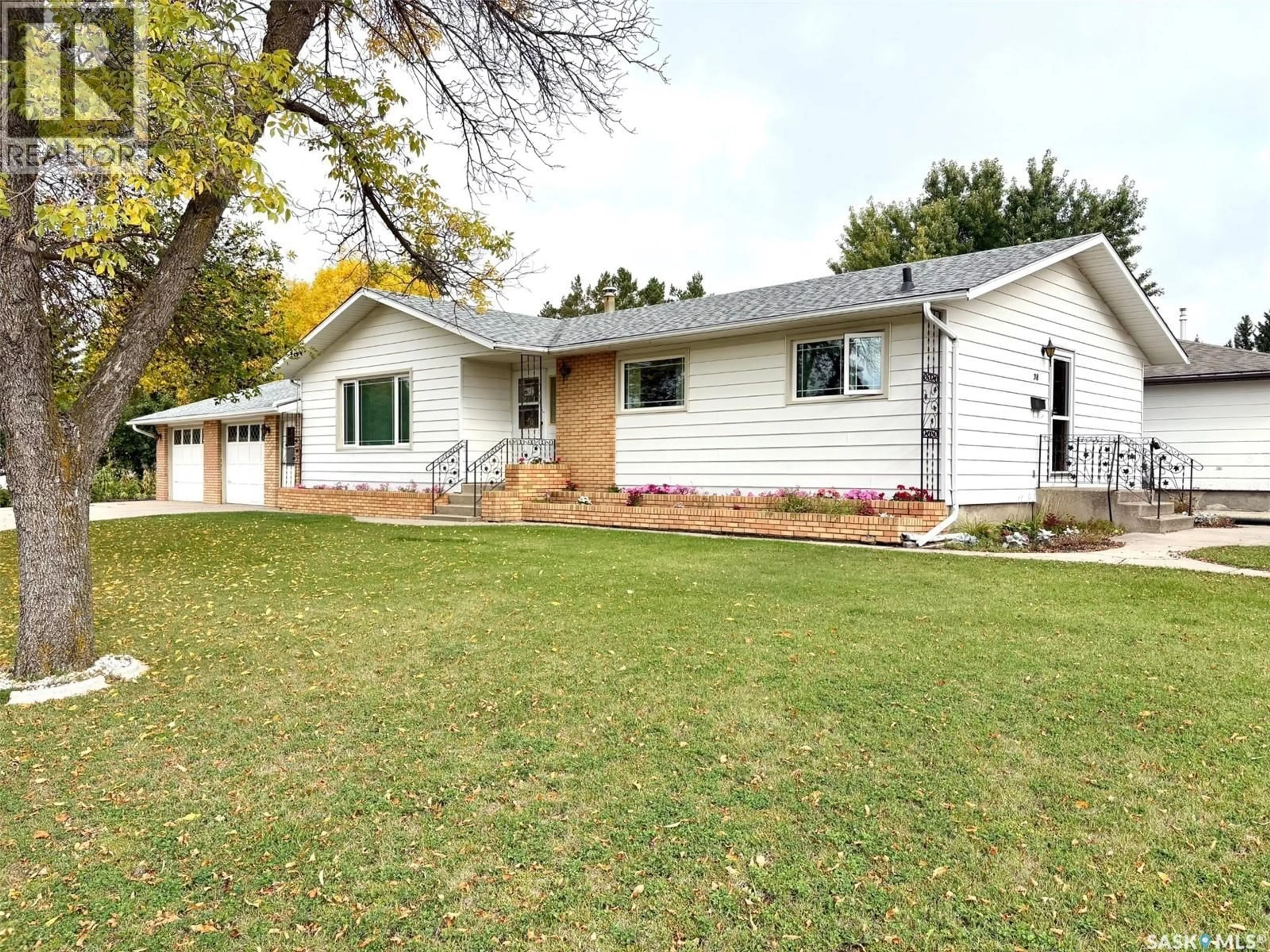 Home with vinyl exterior material, street for 38 ROSEFIELD DRIVE, Yorkton Saskatchewan S3N2R4