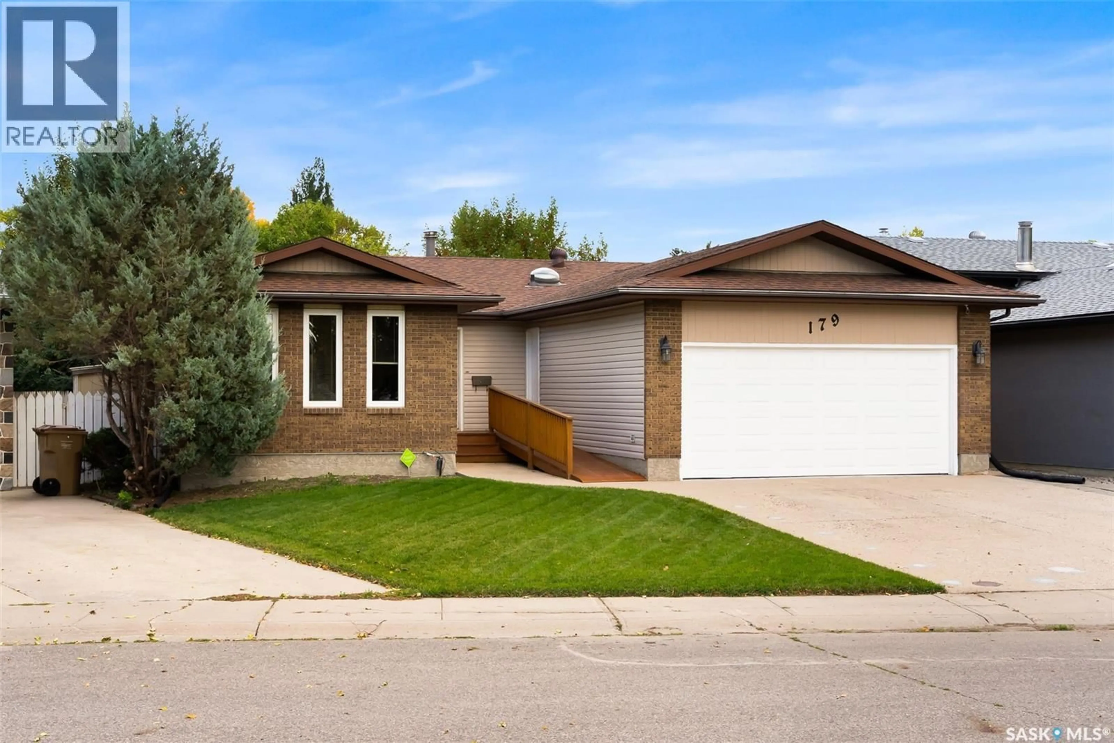Home with brick exterior material, street for 179 MCINNIS CRESCENT, Regina Saskatchewan S4R3E9