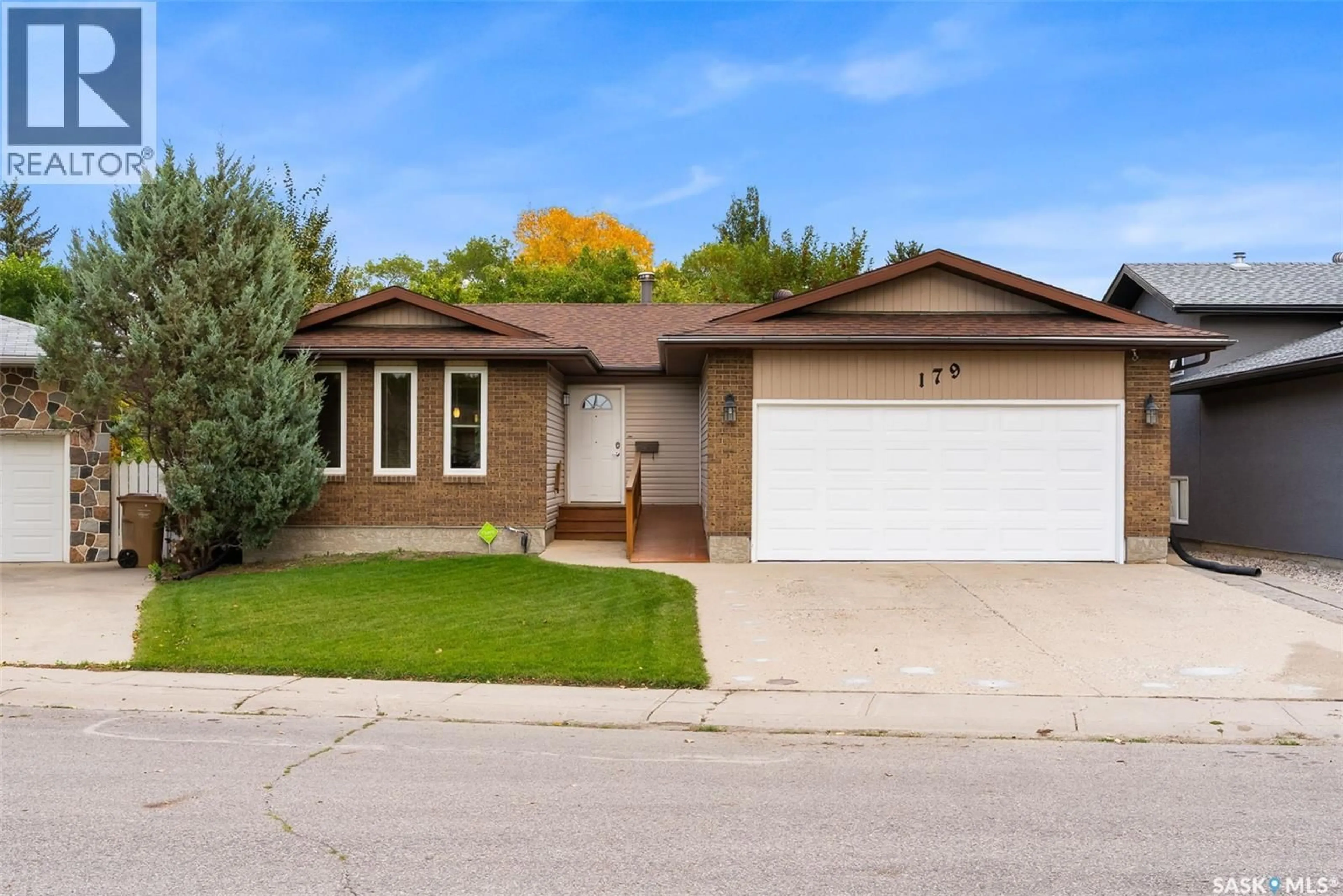 Home with brick exterior material, street for 179 MCINNIS CRESCENT, Regina Saskatchewan S4R3E9