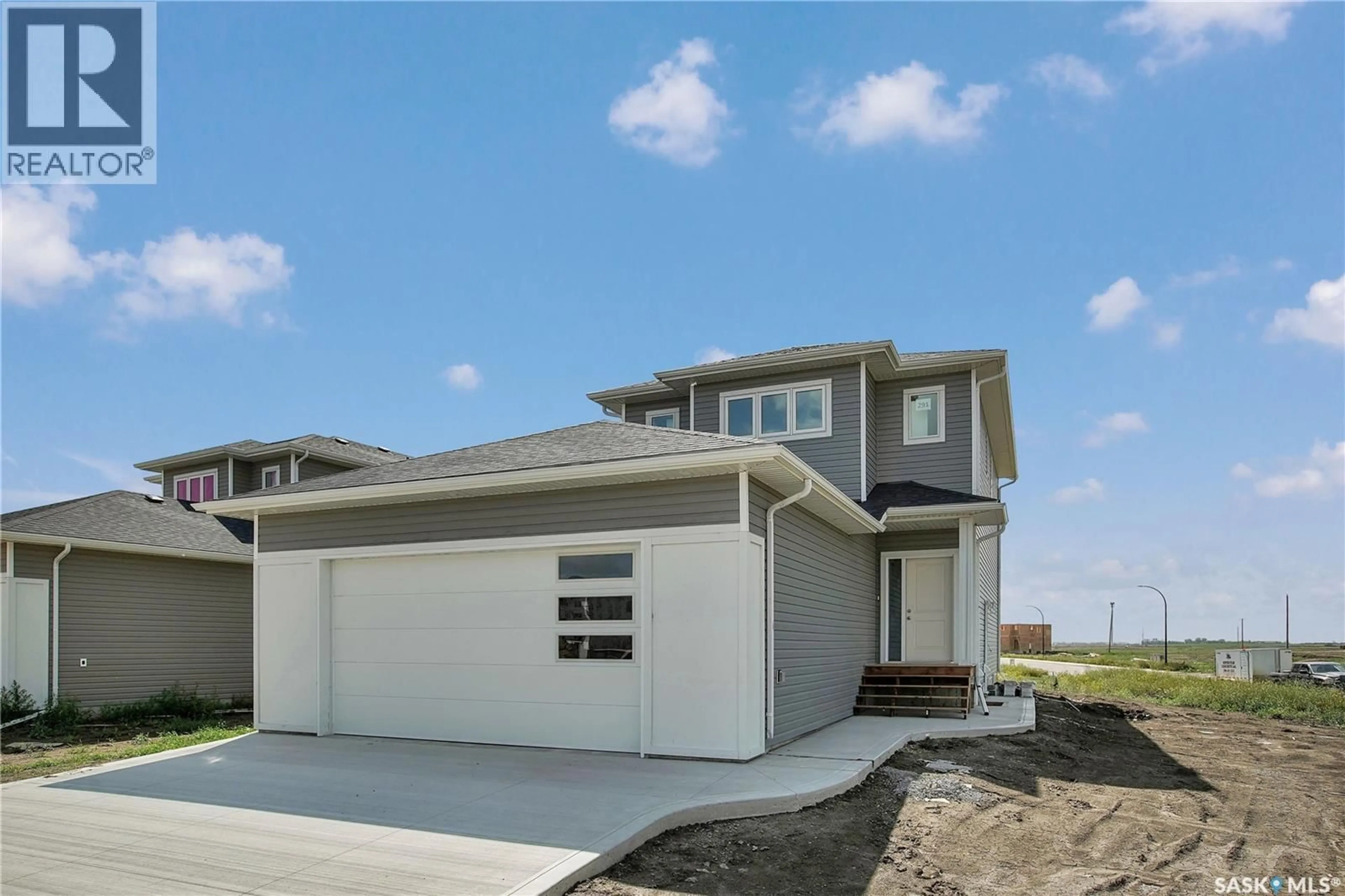 Home with vinyl exterior material, street for 423 STROMBERG CRESCENT, Saskatoon Saskatchewan S7L7N2