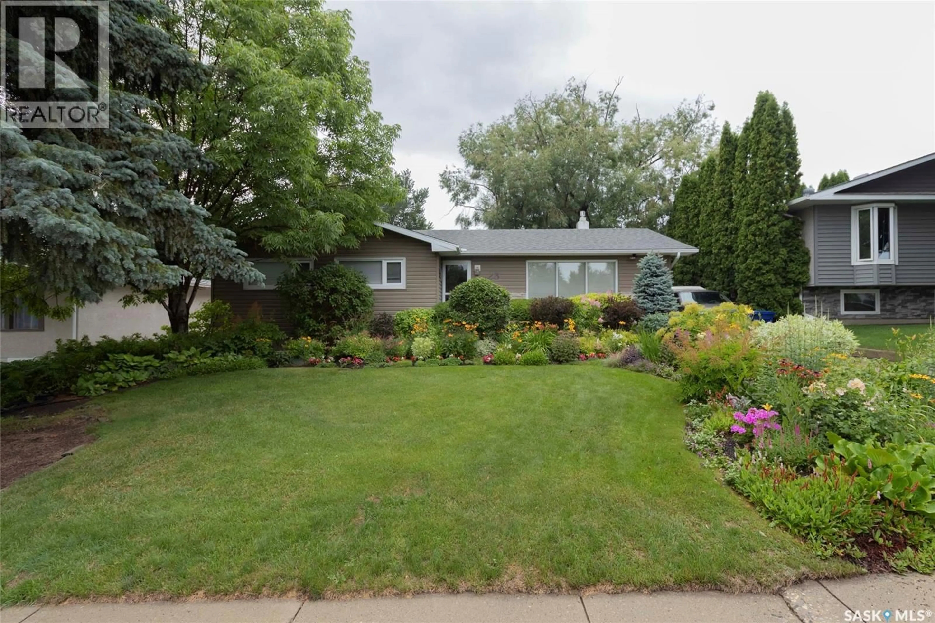 Home with vinyl exterior material, street for 23 BALDWIN CRESCENT, Saskatoon Saskatchewan S7H3M5