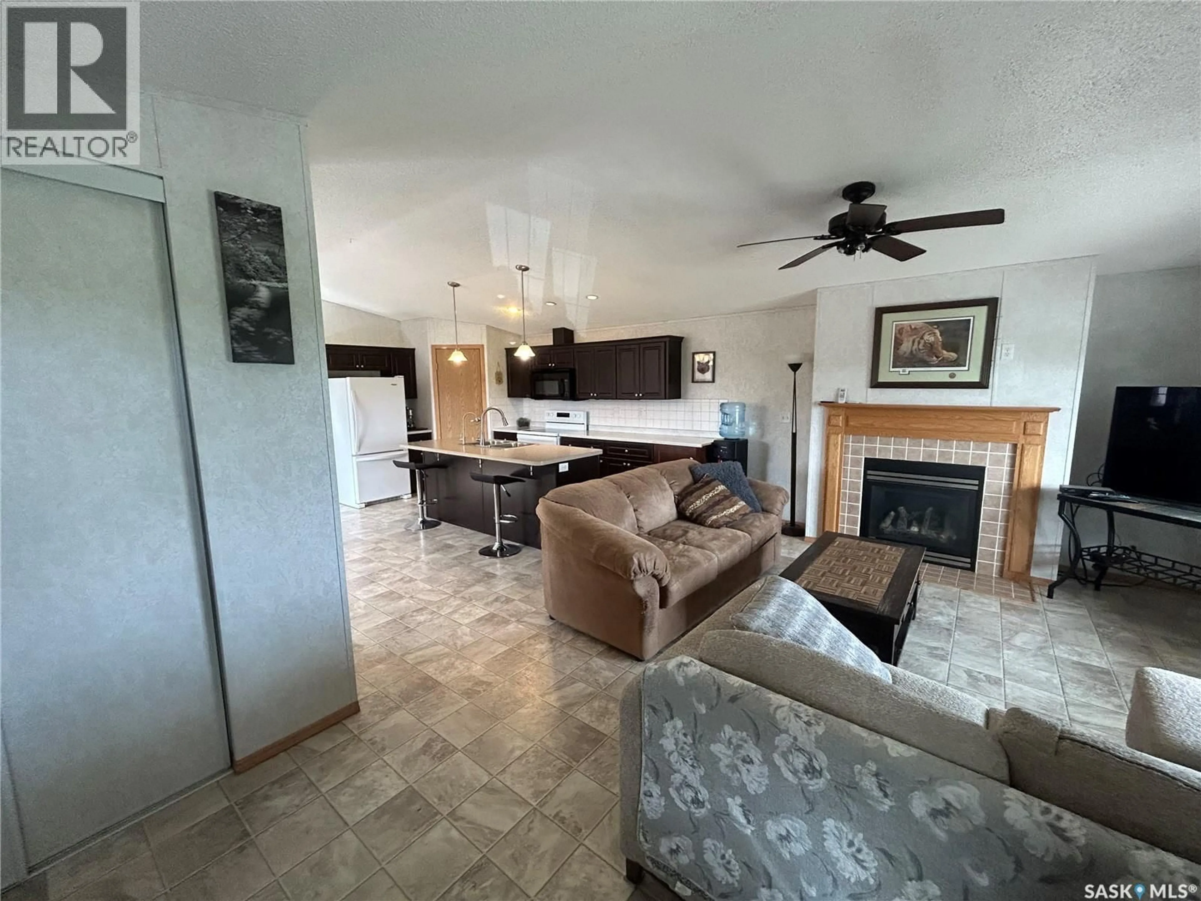 Living room with furniture, ceramic/tile floor for 187 ROBINSON AVENUE, Macoun Saskatchewan S0C1P0