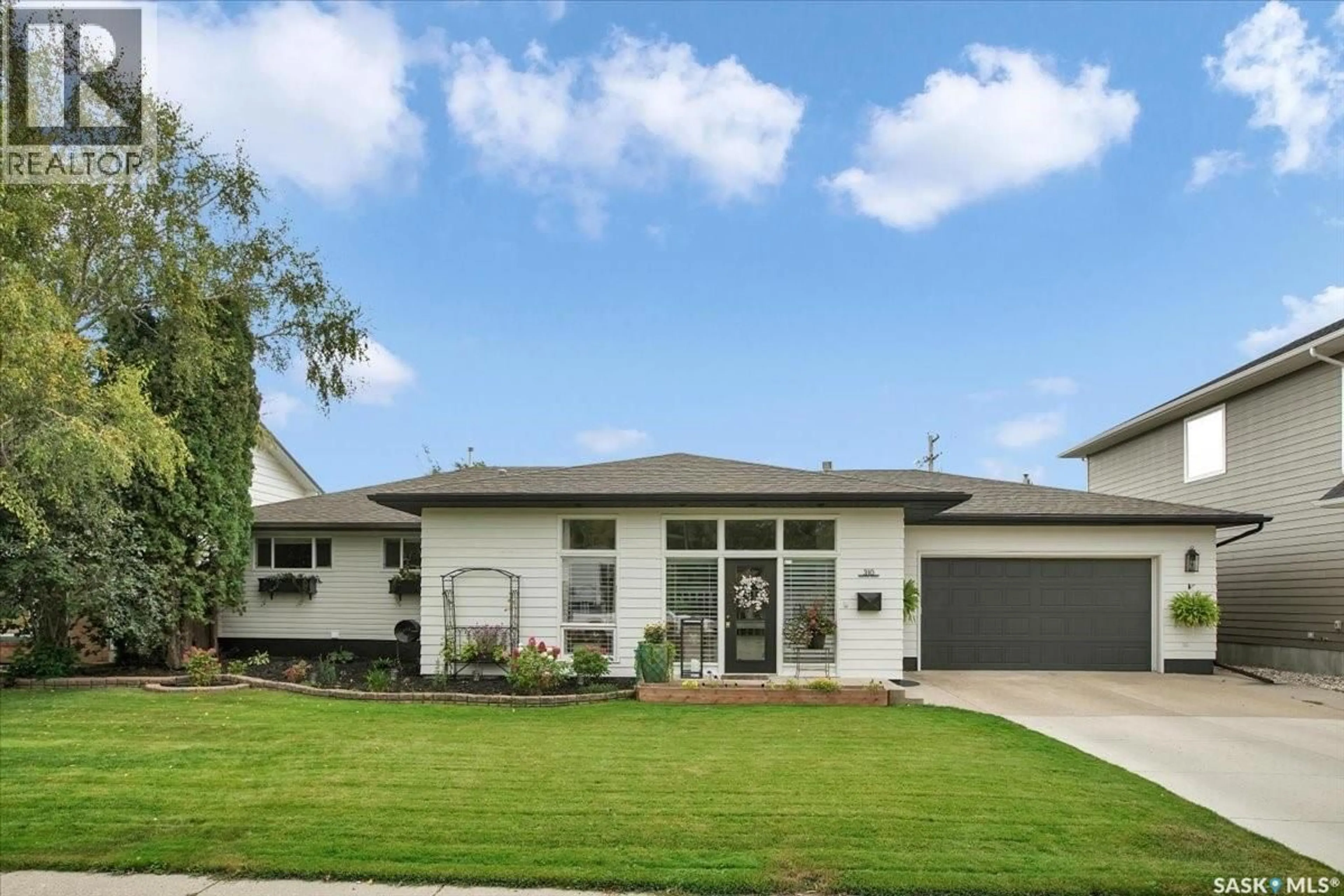 Home with vinyl exterior material, street for 310 WILLOW STREET, Saskatoon Saskatchewan S7J0C6