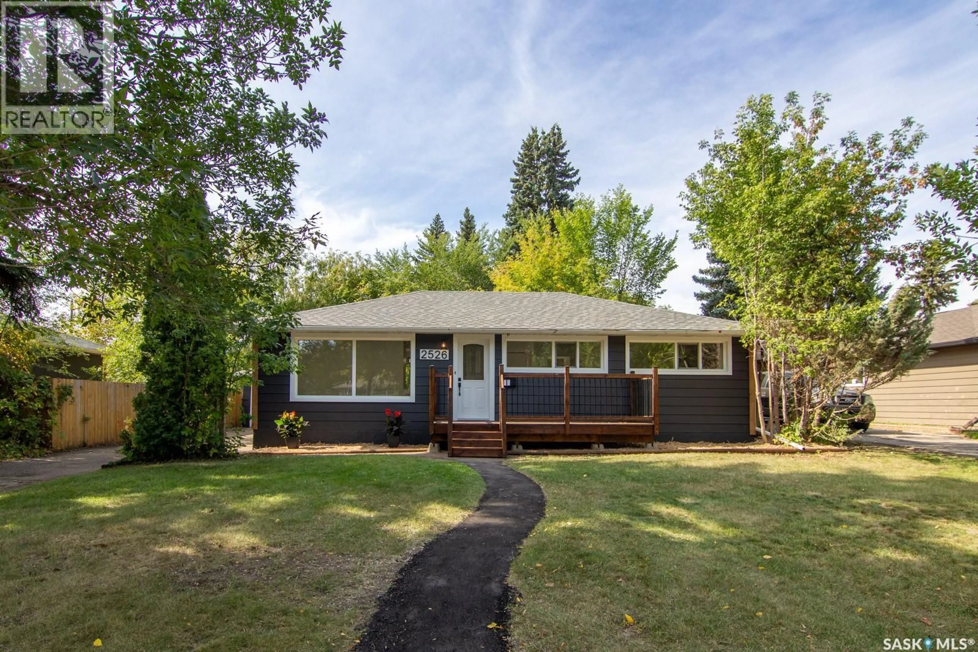 Home with vinyl exterior material, street for 2526 BROADWAY AVENUE, Saskatoon Saskatchewan S7J0Z2