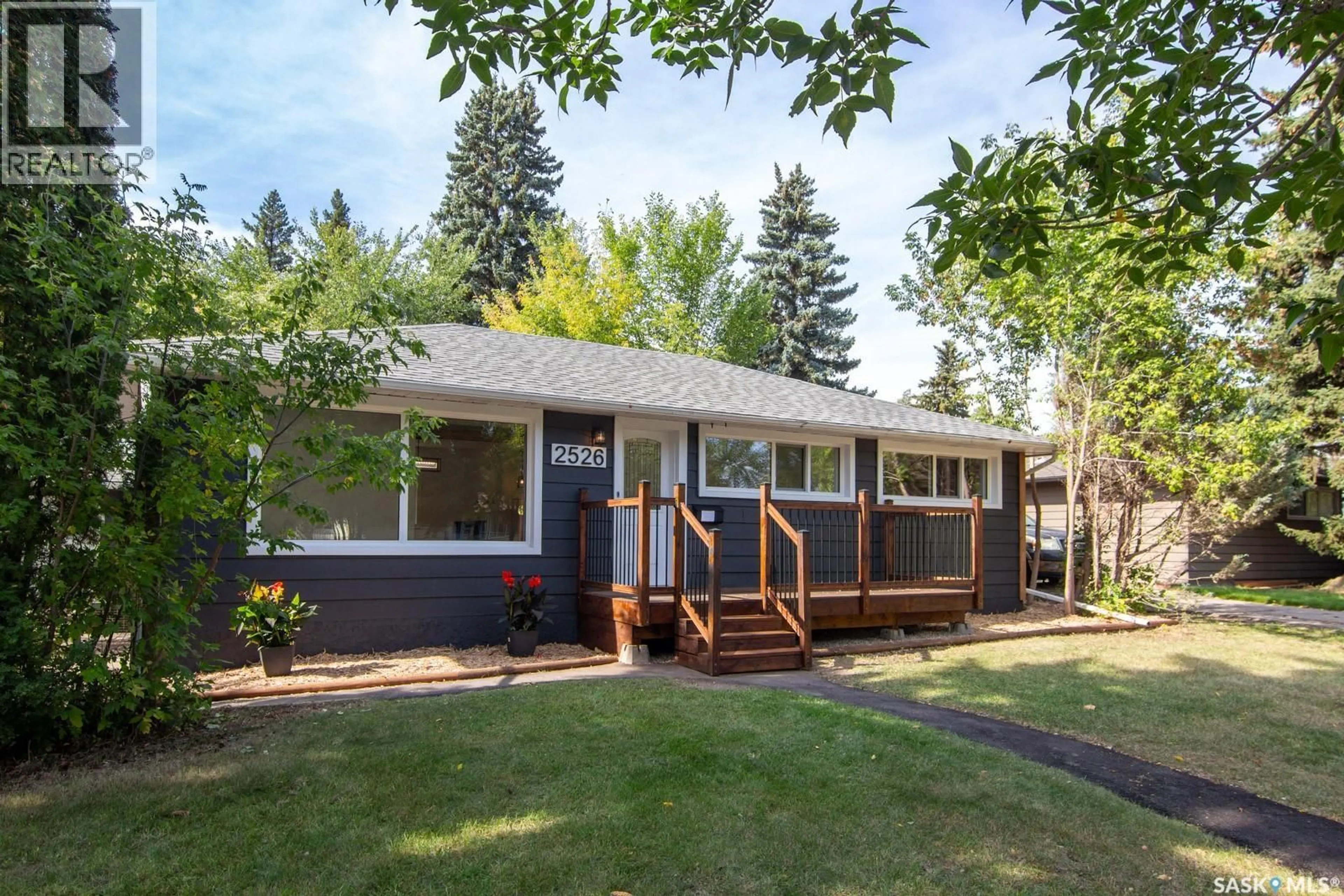 Home with vinyl exterior material, street for 2526 BROADWAY AVENUE, Saskatoon Saskatchewan S7J0Z2