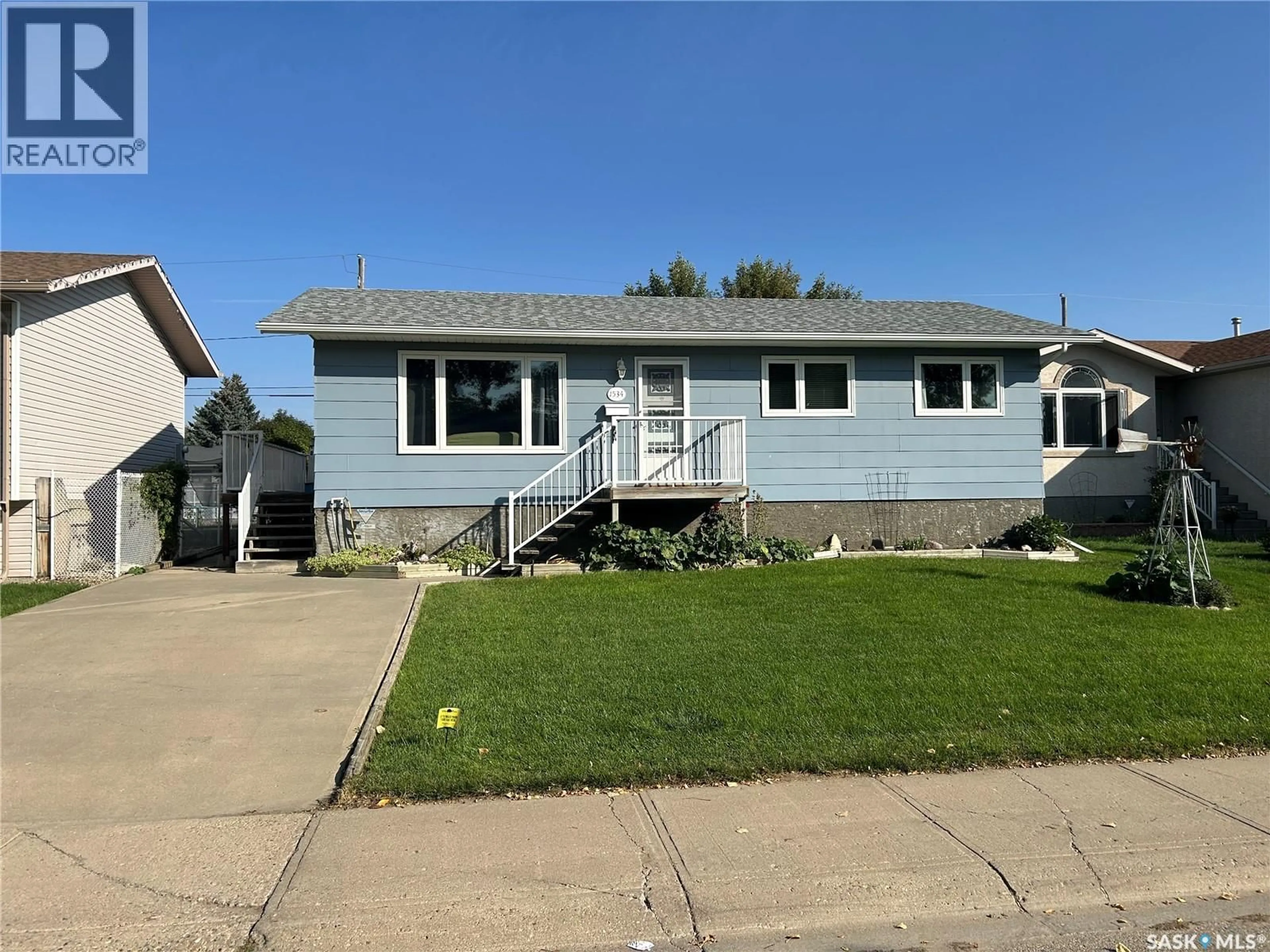 Home with vinyl exterior material, street for 1534 ATHABASCA STREET, Moose Jaw Saskatchewan S6H7K4