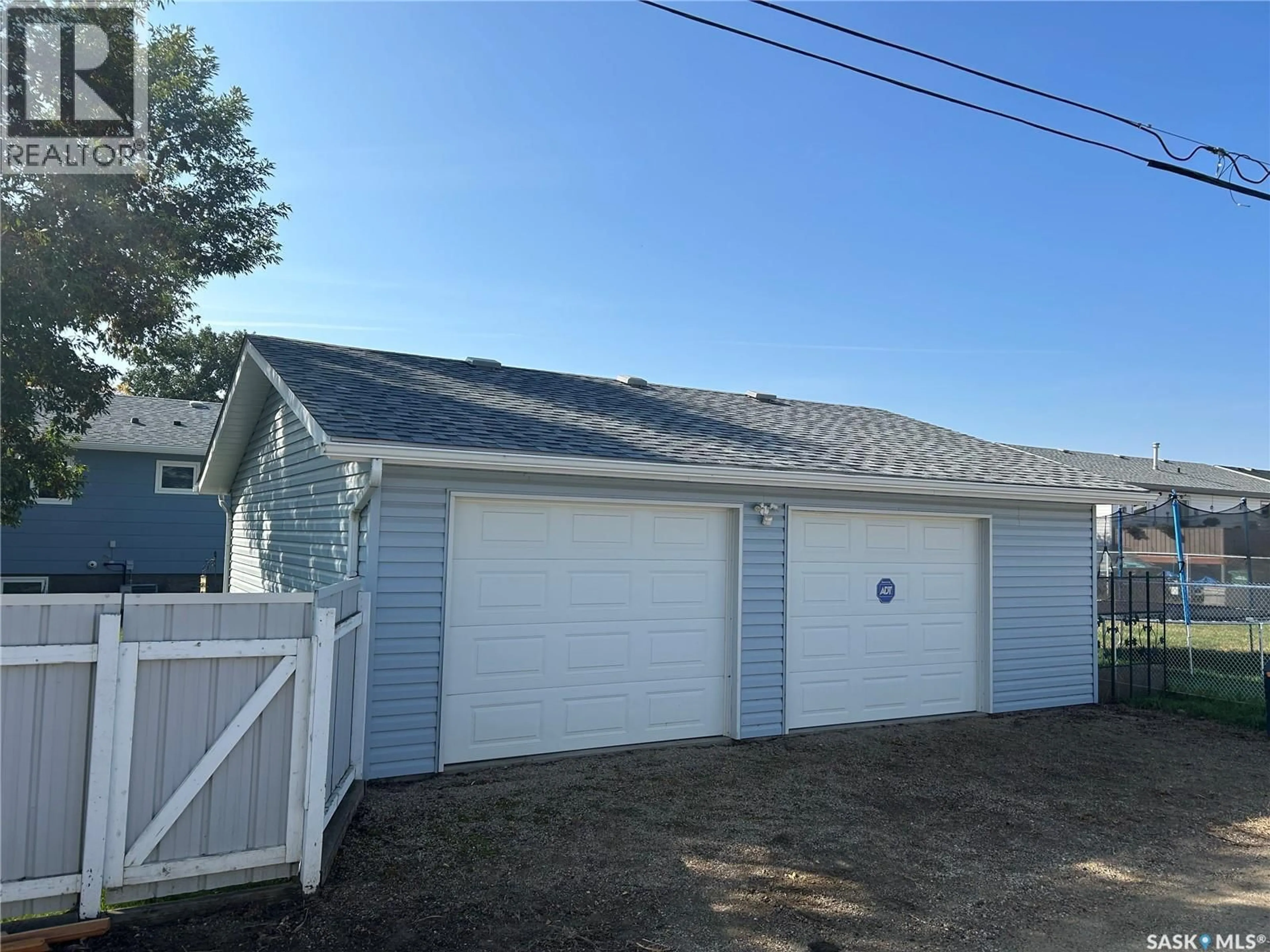 Home with vinyl exterior material, street for 1534 ATHABASCA STREET, Moose Jaw Saskatchewan S6H7K4
