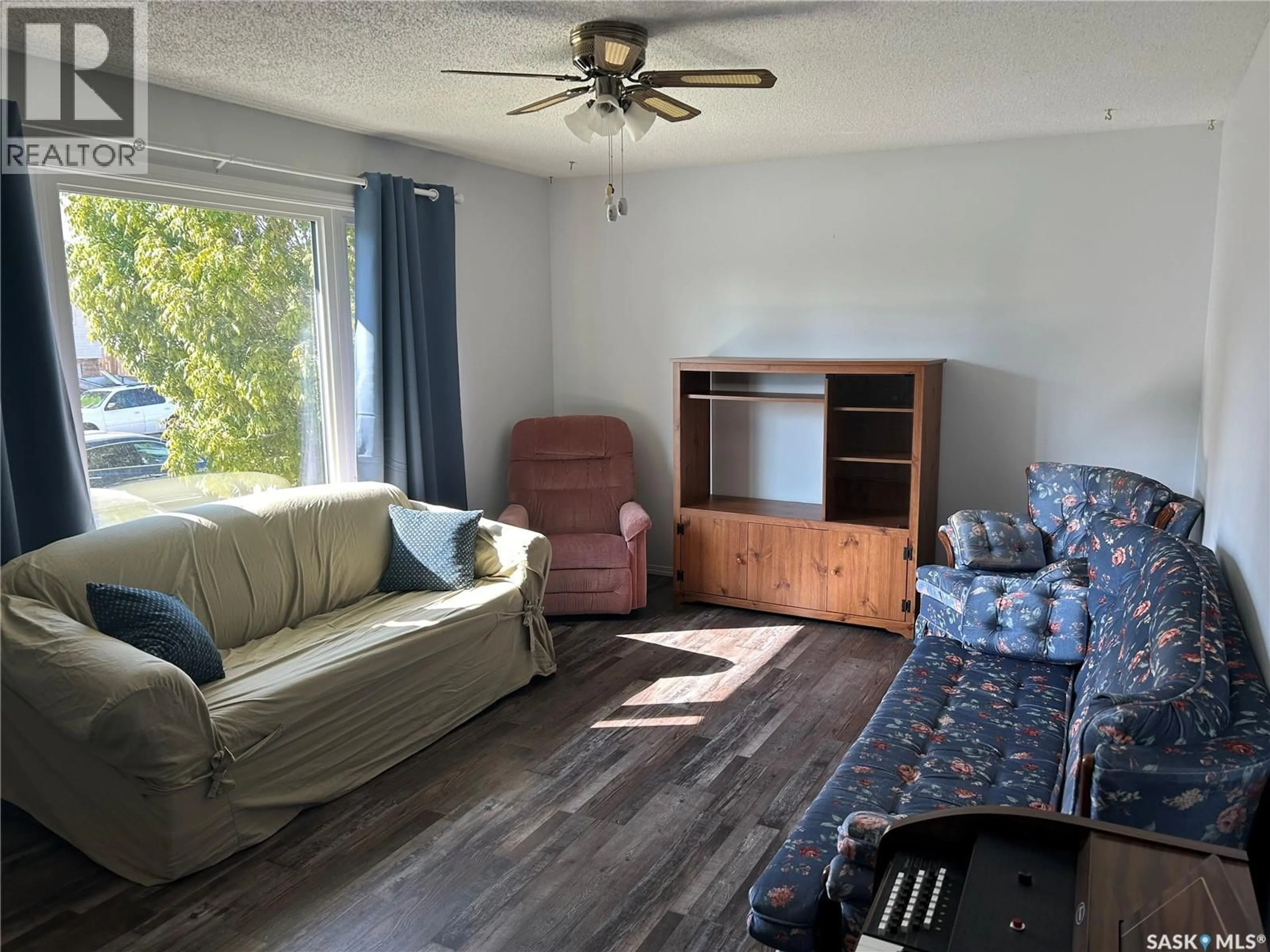 Living room with furniture, wood/laminate floor for 1534 ATHABASCA STREET, Moose Jaw Saskatchewan S6H7K4