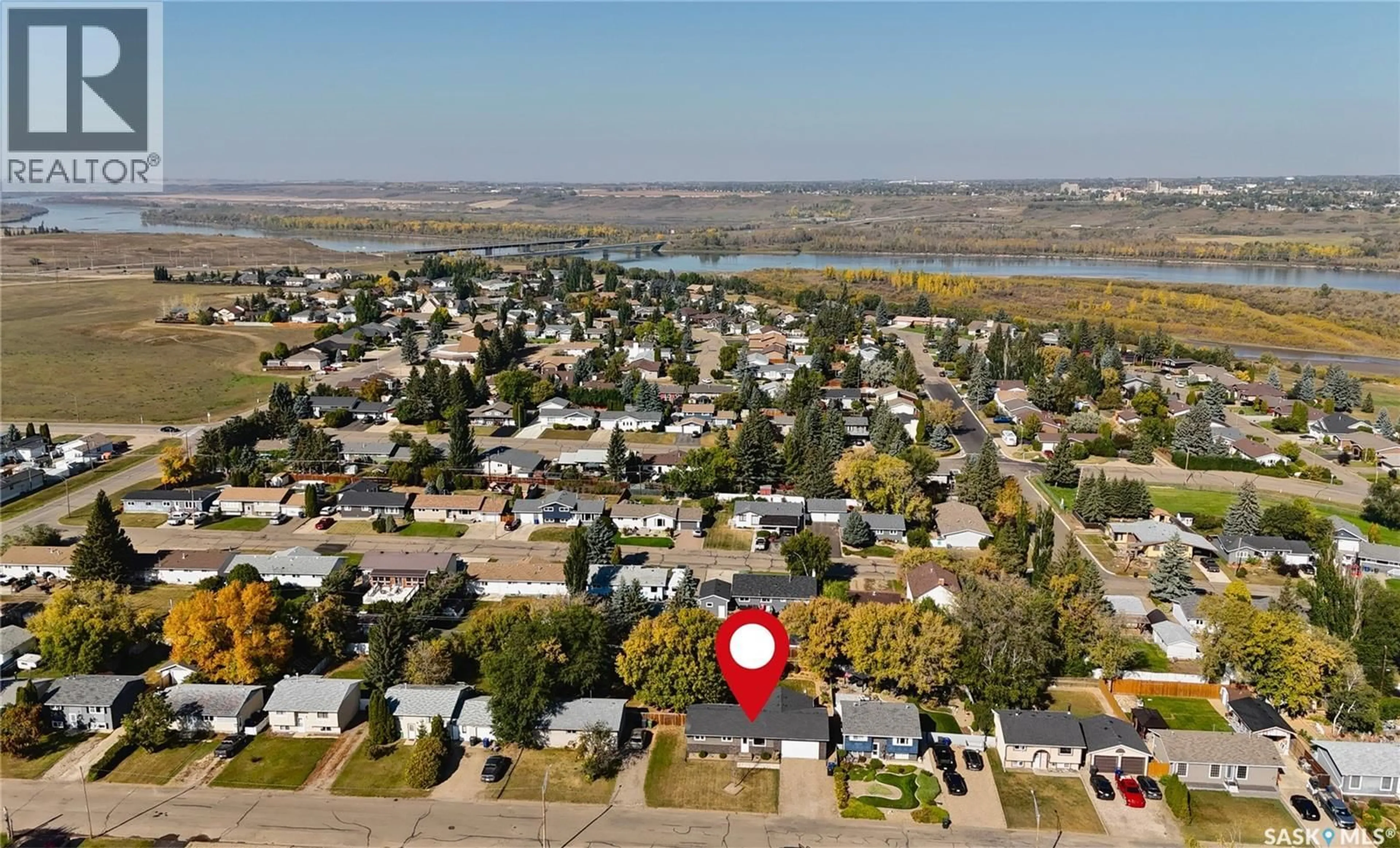 A pic from outside/outdoor area/front of a property/back of a property/a pic from drone, water/lake/river/ocean view for 322 33RD STREET, Battleford Saskatchewan S0M0E0