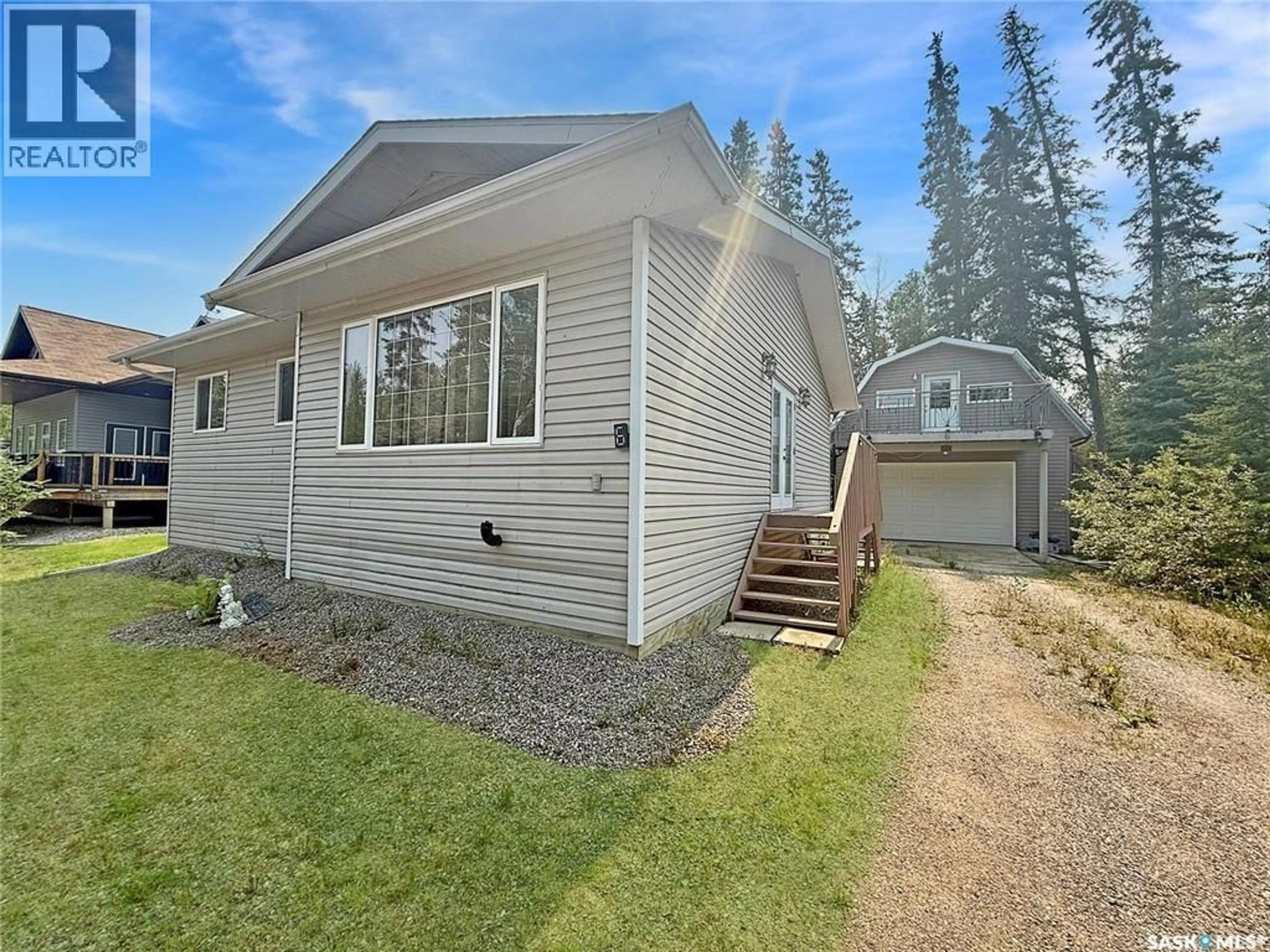 Home with vinyl exterior material, street for 6 TYE PLACE, Candle Lake Saskatchewan S0J3E0