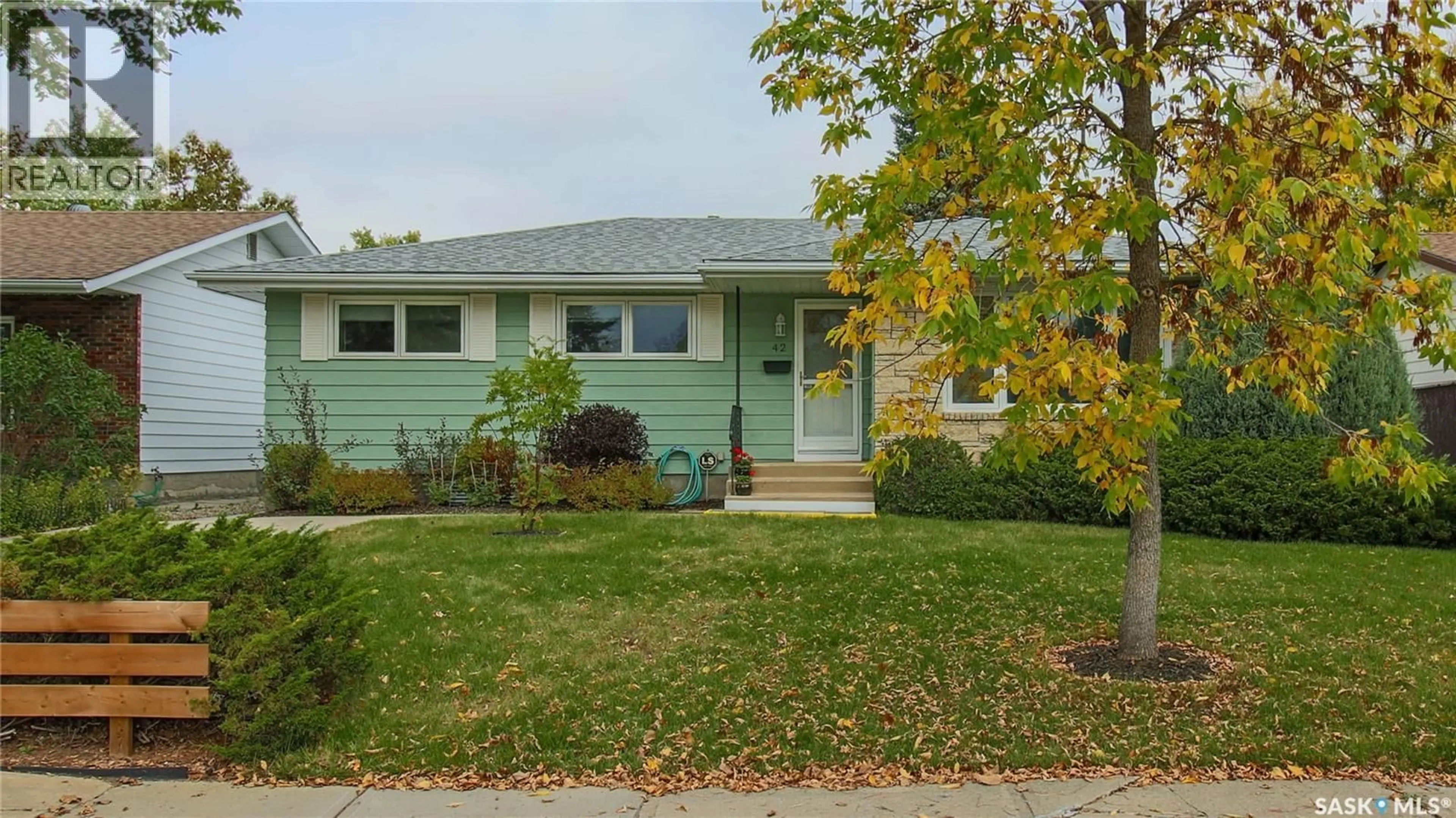 Home with vinyl exterior material, street for 42 HAWKES AVENUE, Regina Saskatchewan S4X1B4