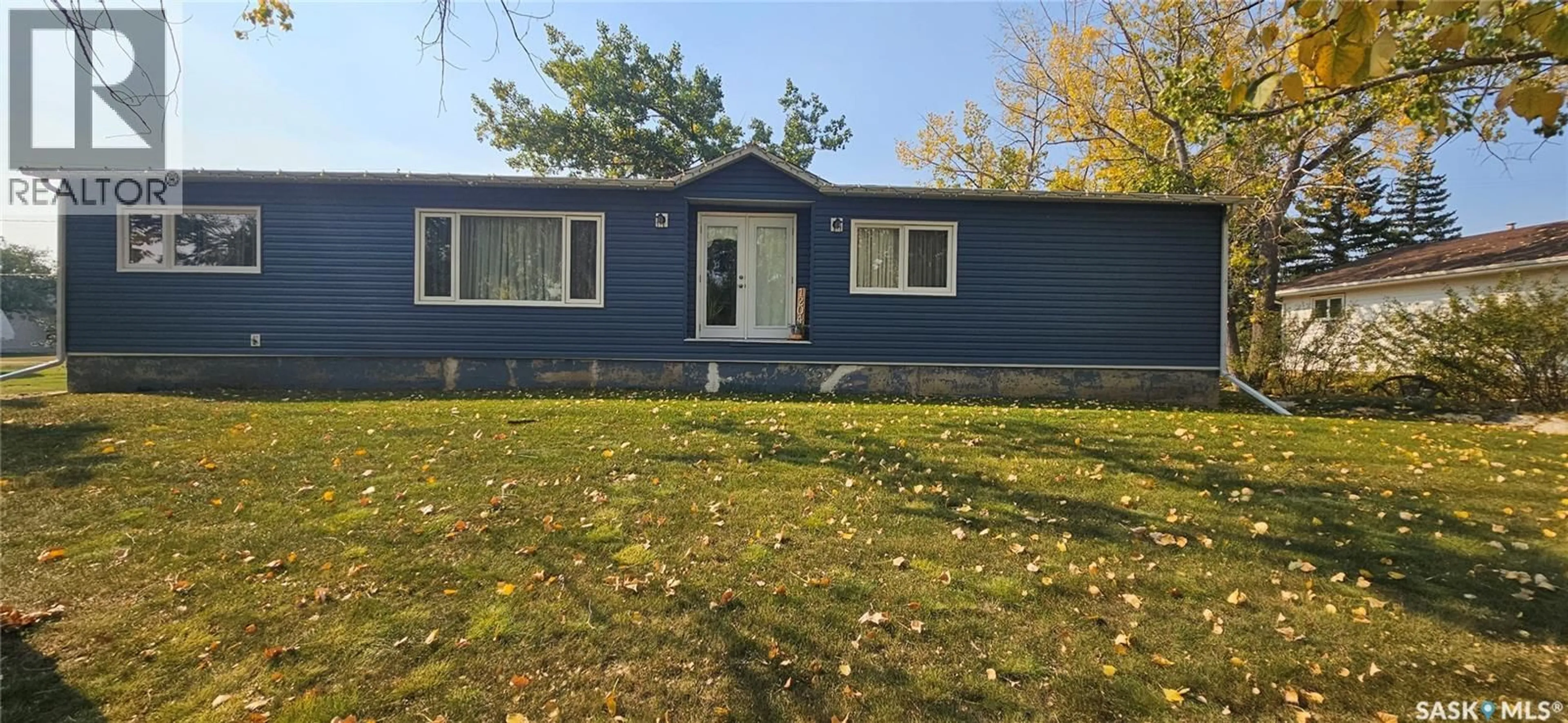 Home with vinyl exterior material, street for 1204 DOMINION STREET, Vanguard Saskatchewan S0N2V0