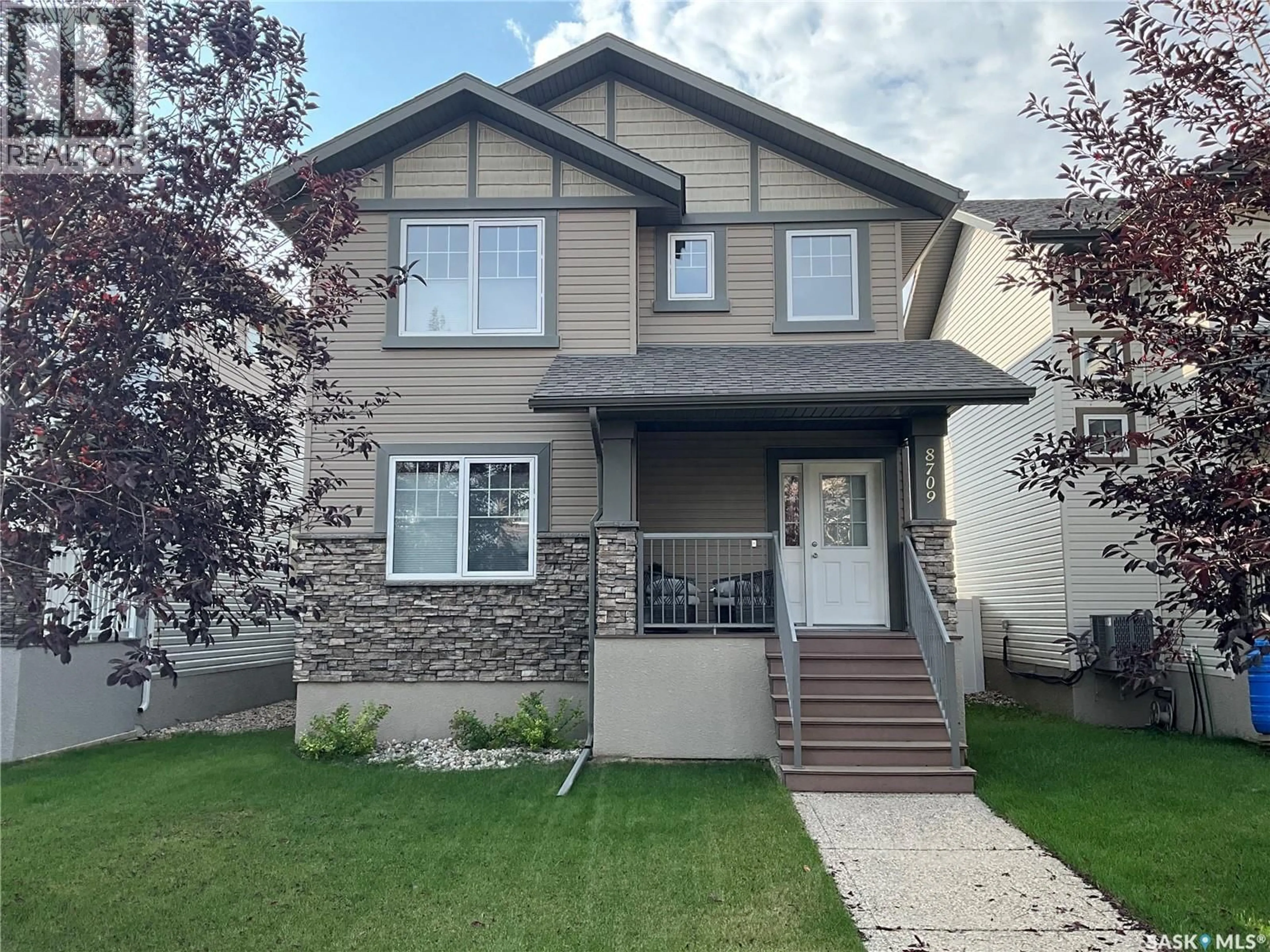 Home with vinyl exterior material, street for 8709 HINCKS LANE, Regina Saskatchewan S4Y0B9