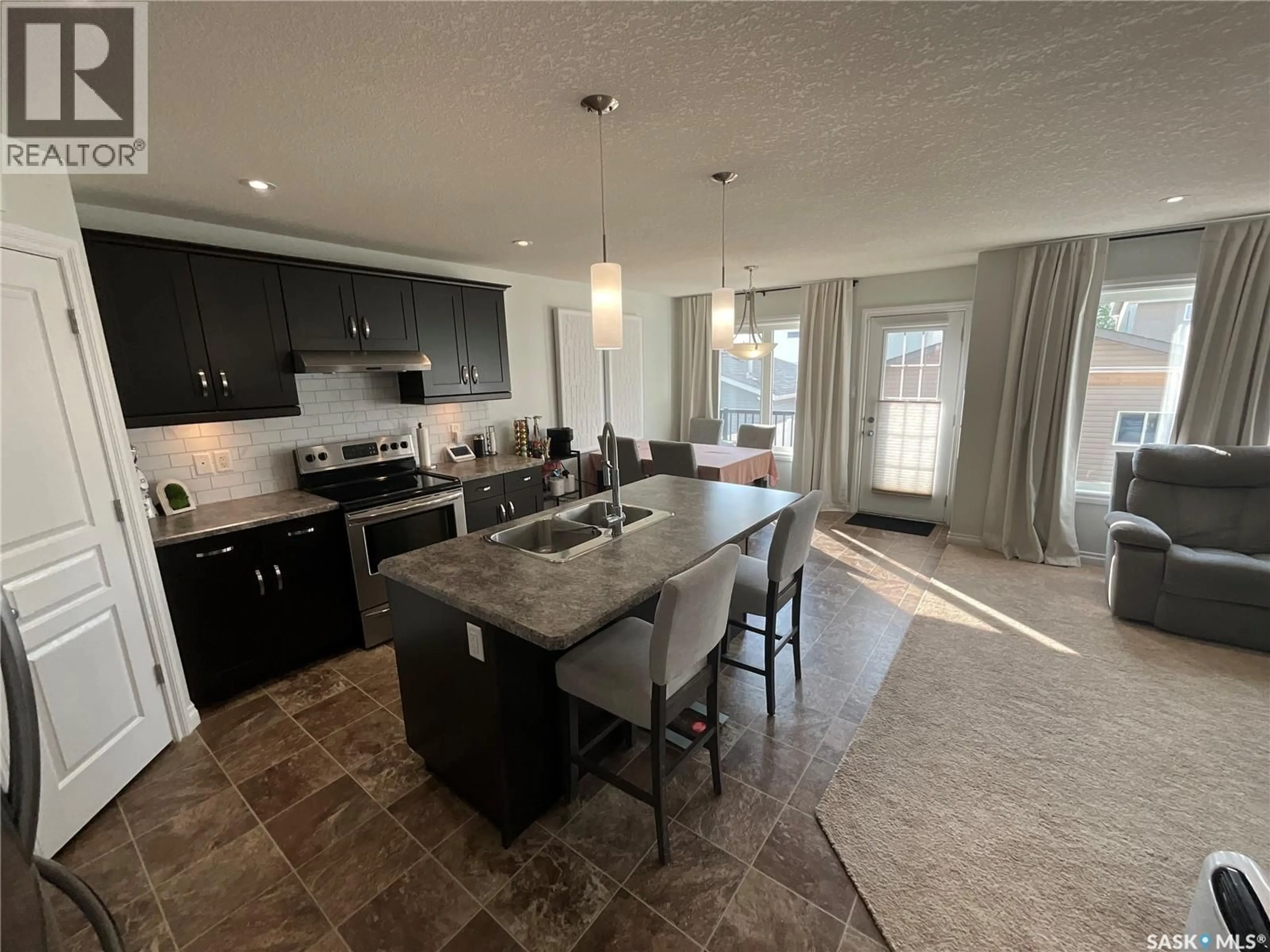 Open concept kitchen, ceramic/tile floor for 8709 HINCKS LANE, Regina Saskatchewan S4Y0B9