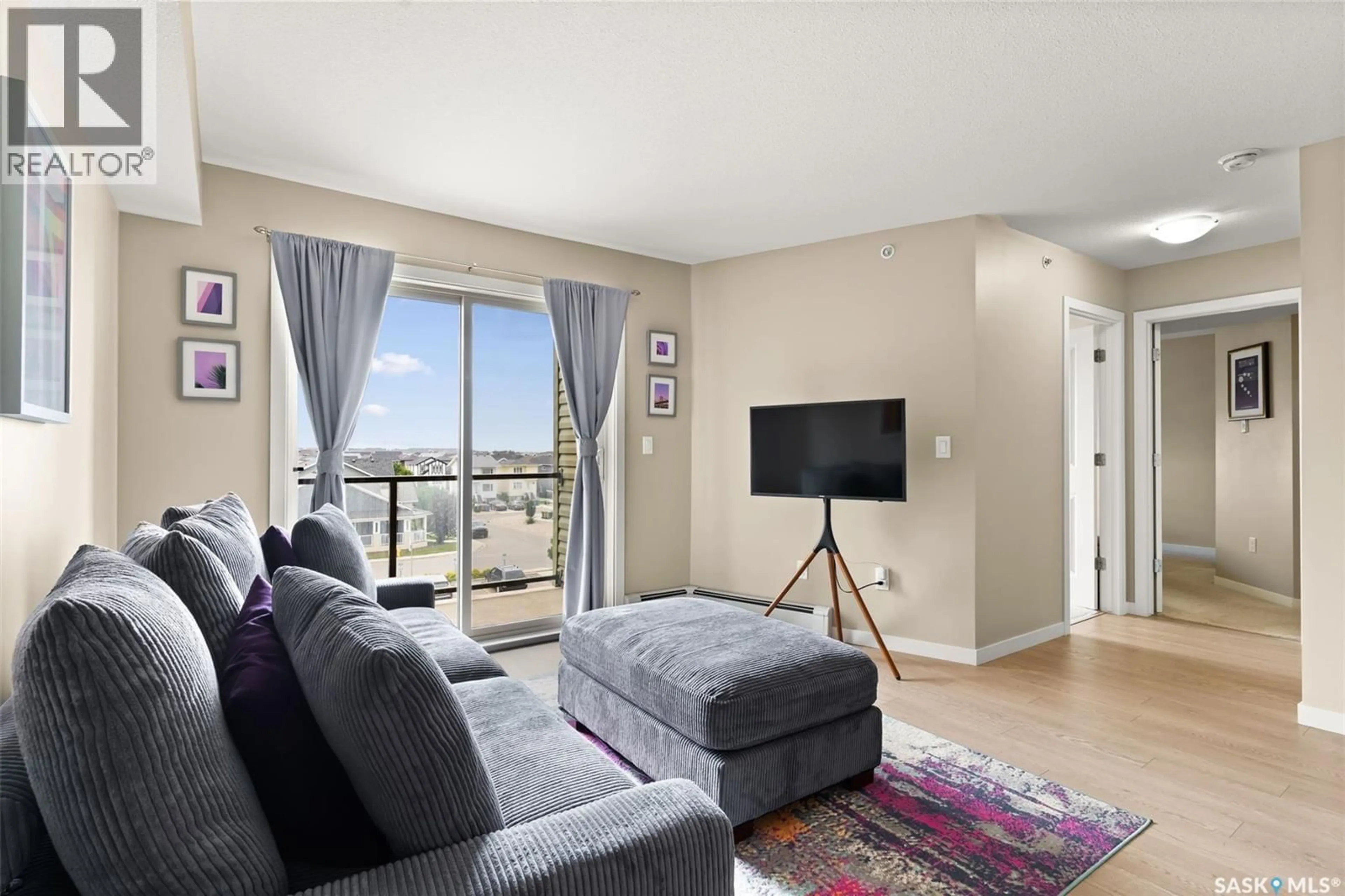 Living room with furniture, unknown for 5500 - 1404 MITCHINSON WAY, Regina Saskatchewan S4W0N9