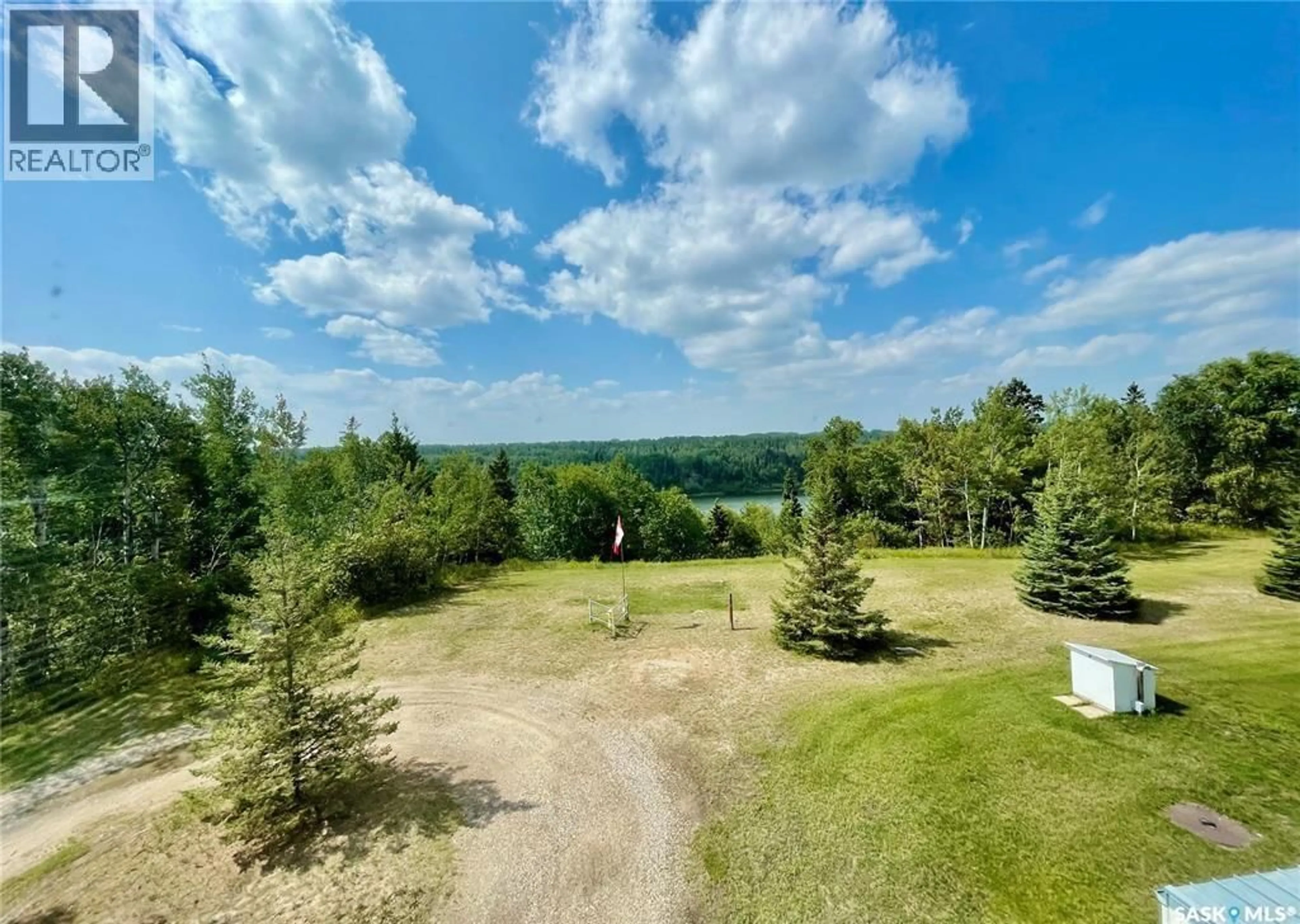 A pic from outside/outdoor area/front of a property/back of a property/a pic from drone, forest/trees view for 208 102 MANOR DRIVE, Nipawin Saskatchewan S0E1E0
