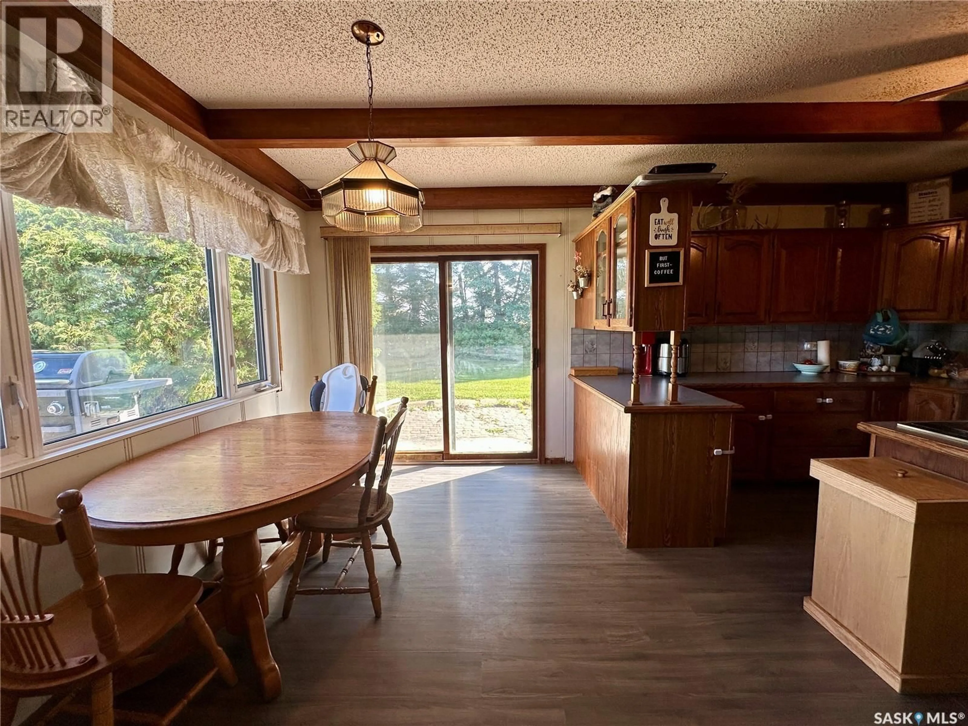 Dining room, wood/laminate floor for KH ACREAGE, Keys Rm No. 303 Saskatchewan S0A2V0