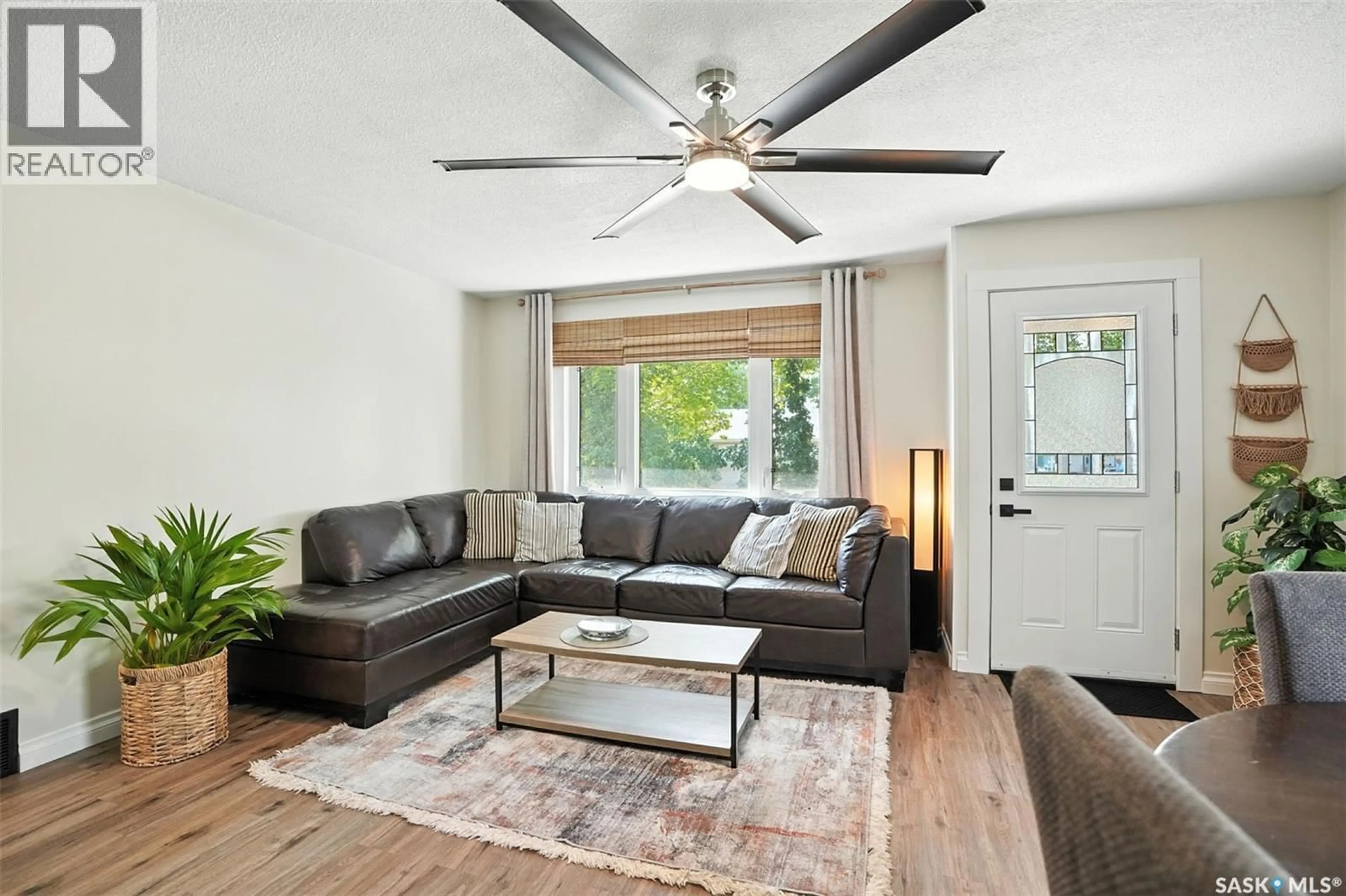 Living room with furniture, wood/laminate floor for 301 3RD AVENUE, Nokomis Saskatchewan S0G3R0