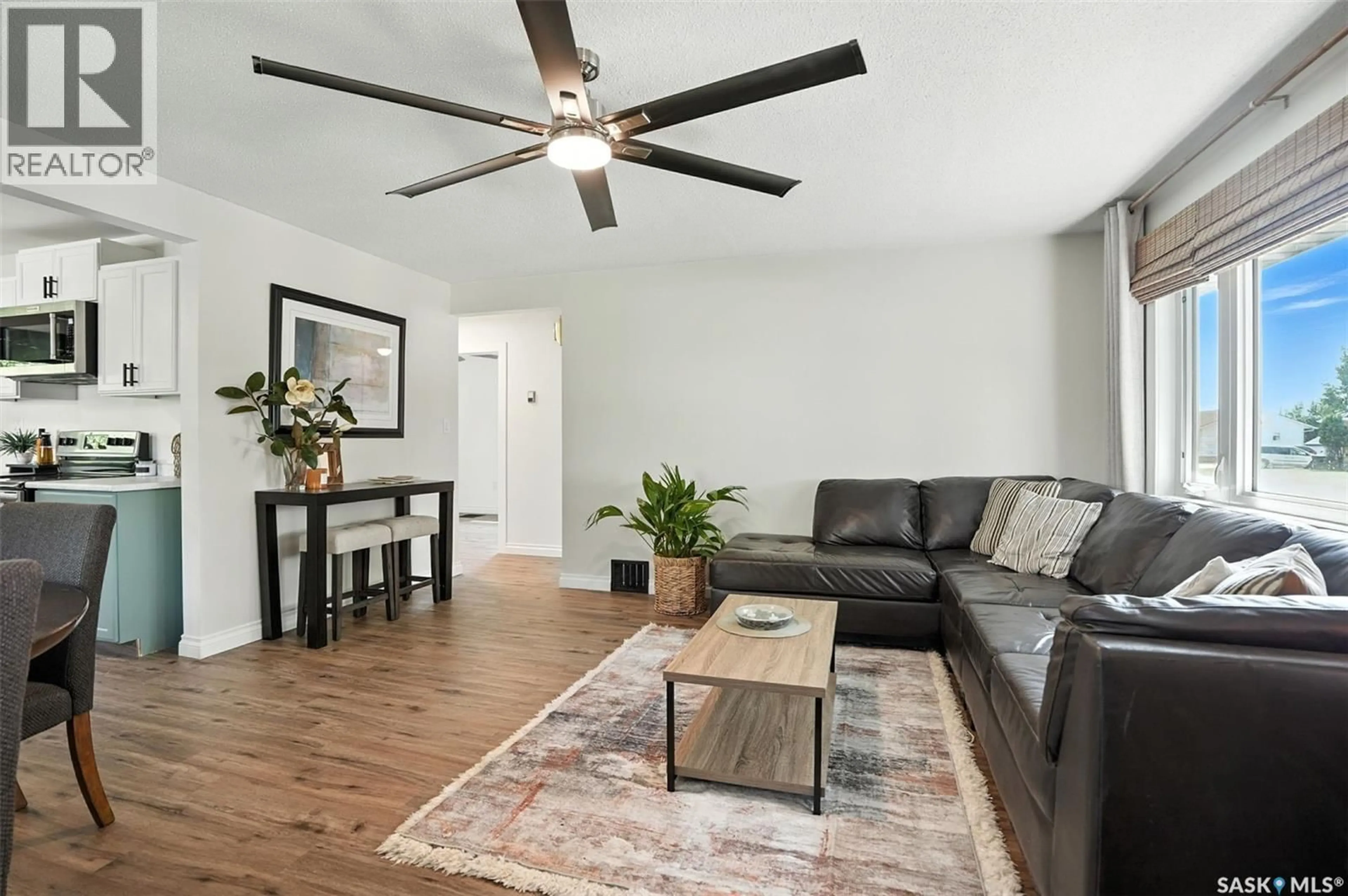 Living room with furniture, wood/laminate floor for 301 3RD AVENUE, Nokomis Saskatchewan S0G3R0