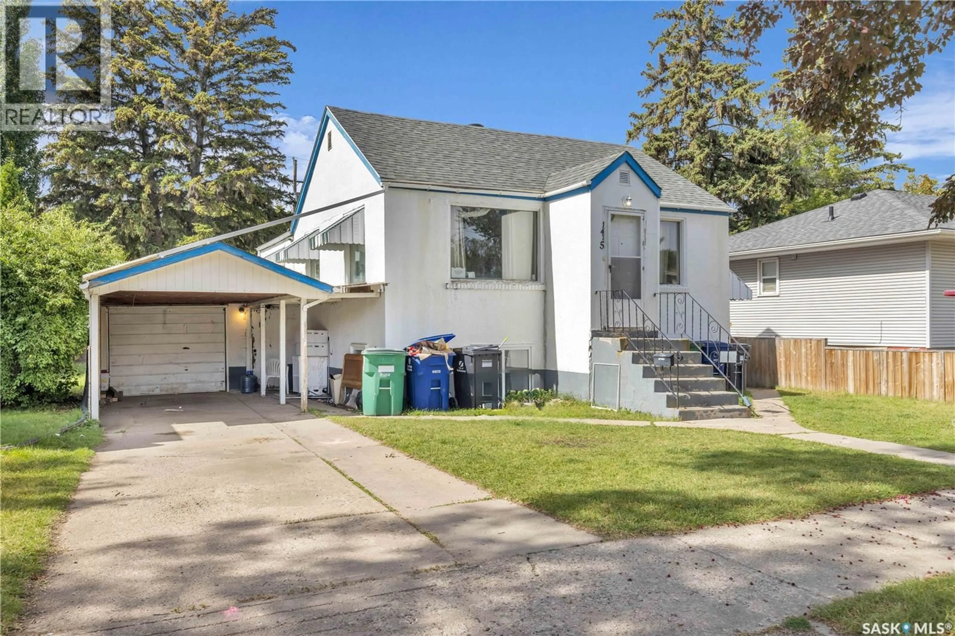 Home with vinyl exterior material, street for 1415 D AVENUE, Saskatoon Saskatchewan S7L1P5