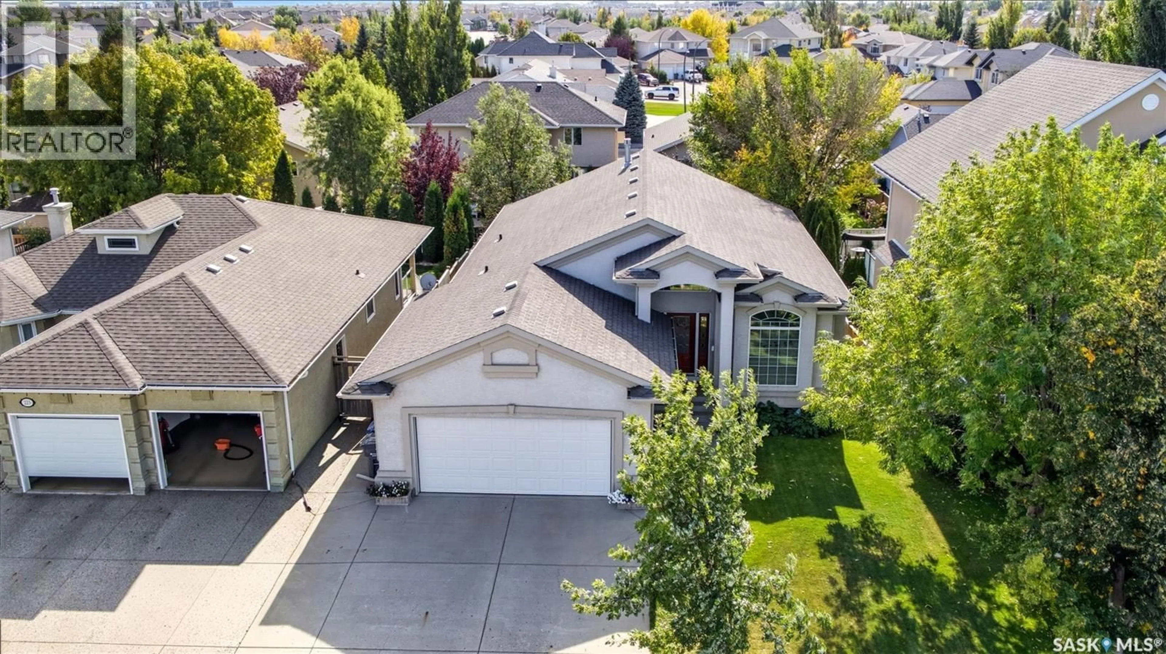 A pic from outside/outdoor area/front of a property/back of a property/a pic from drone, street for 219 BROOKHURST CRESCENT, Saskatoon Saskatchewan S7V1C5
