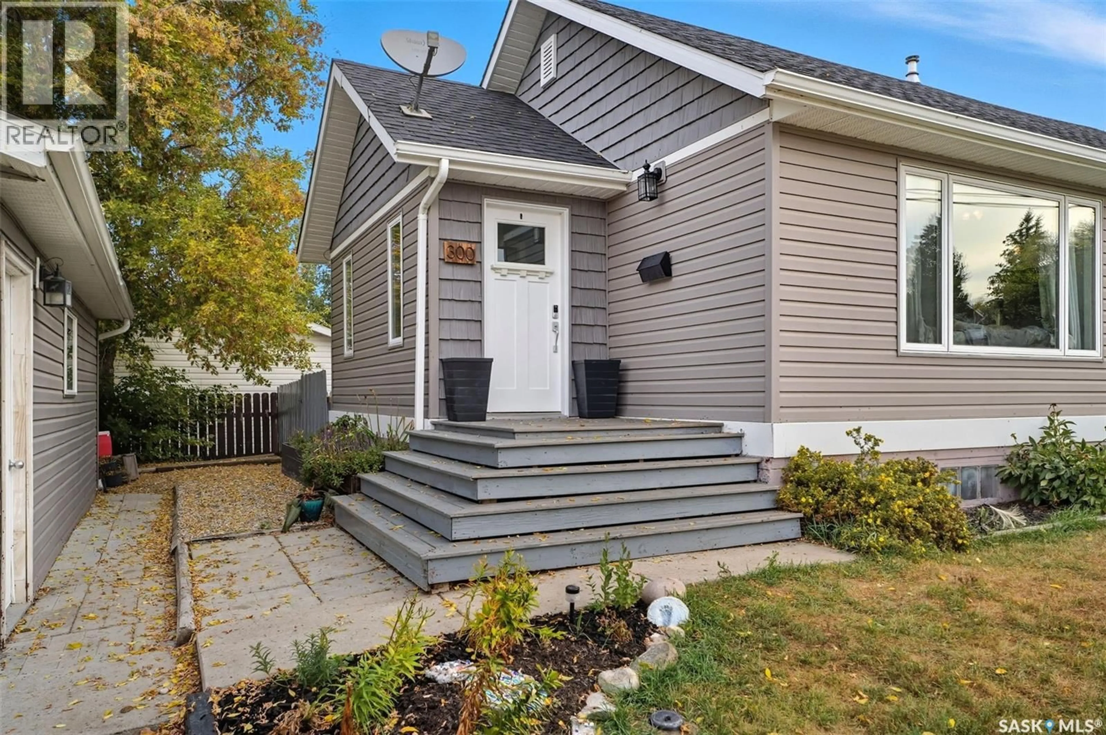 Home with vinyl exterior material, street for 300 3RD STREET, Delisle Saskatchewan S0L0P0