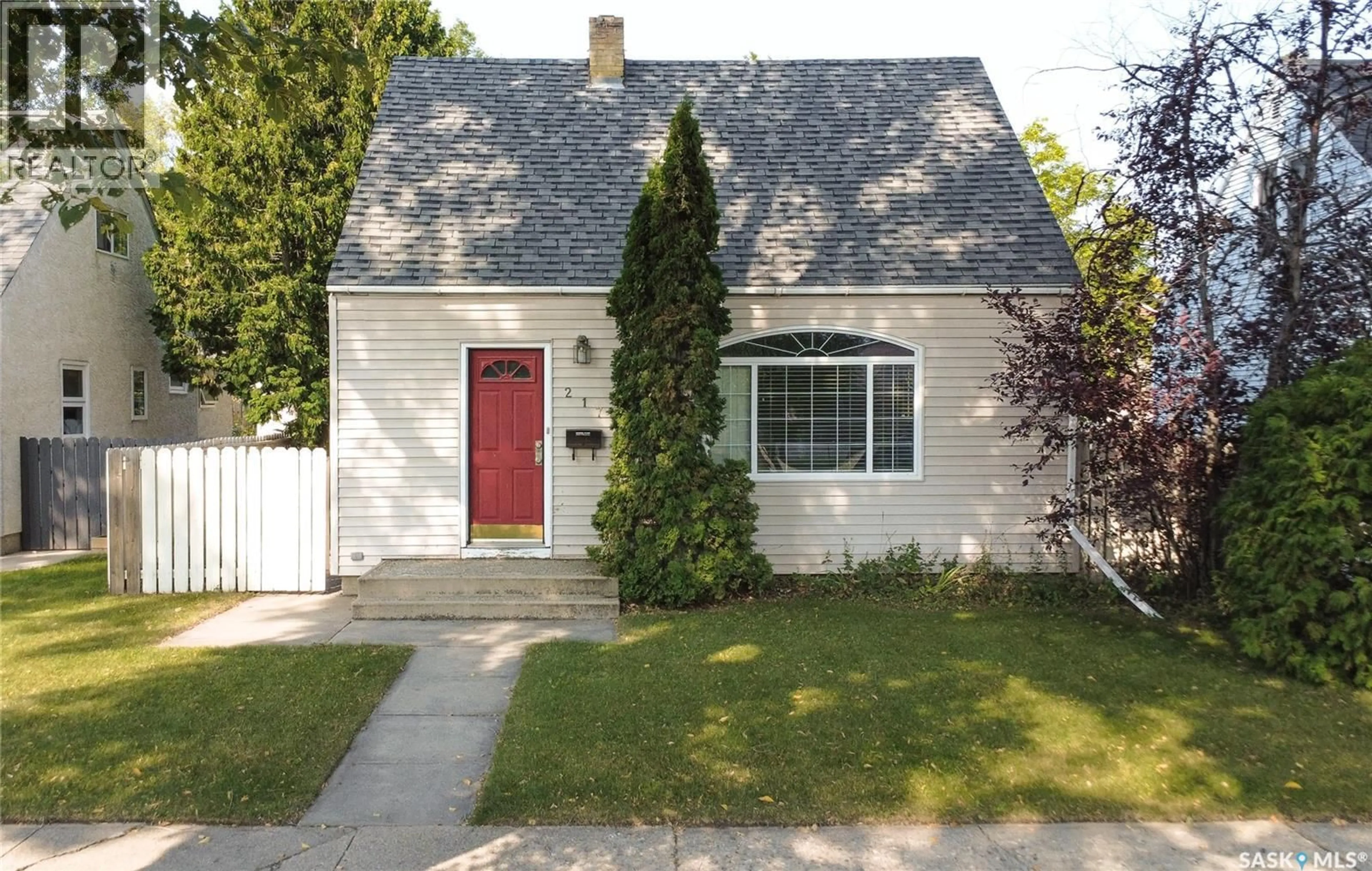Home with vinyl exterior material, street for 217 WILLOW STREET, Saskatoon Saskatchewan S7J0C3