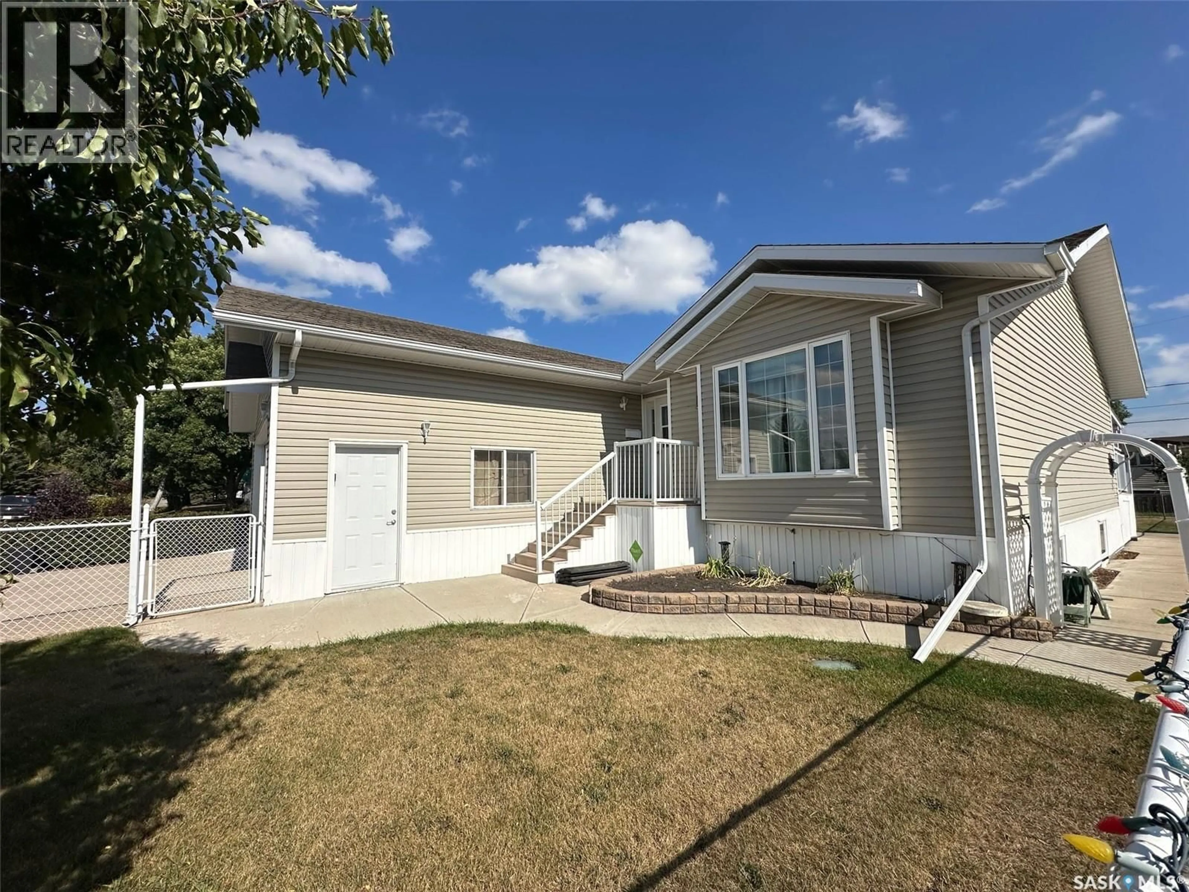 Home with vinyl exterior material, street for 614 HUDSON STREET, Hudson Bay Saskatchewan S0E0Y0