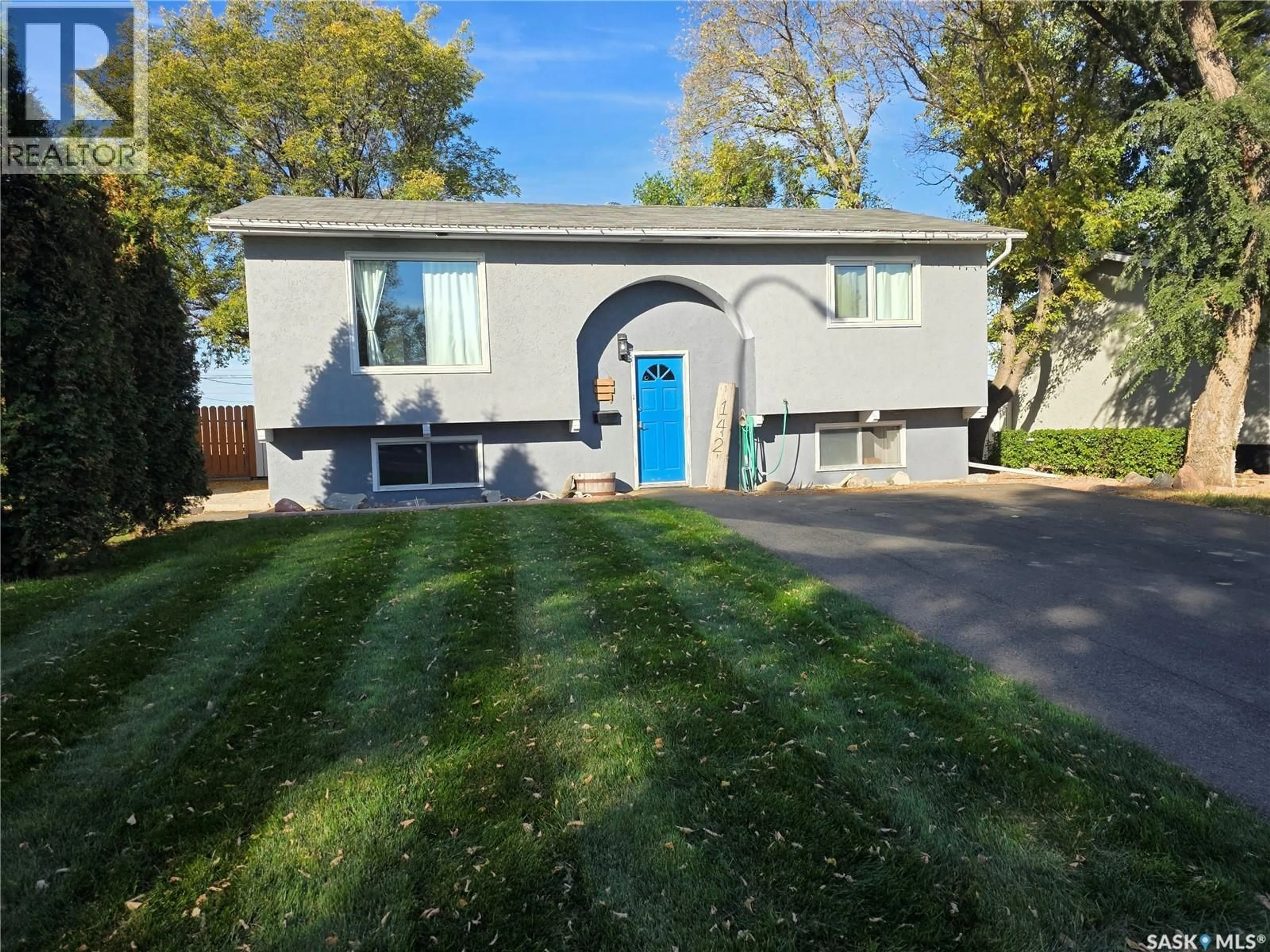 Home with vinyl exterior material, street for 142 1ST AVENUE, Swift Current Saskatchewan S9H3H2