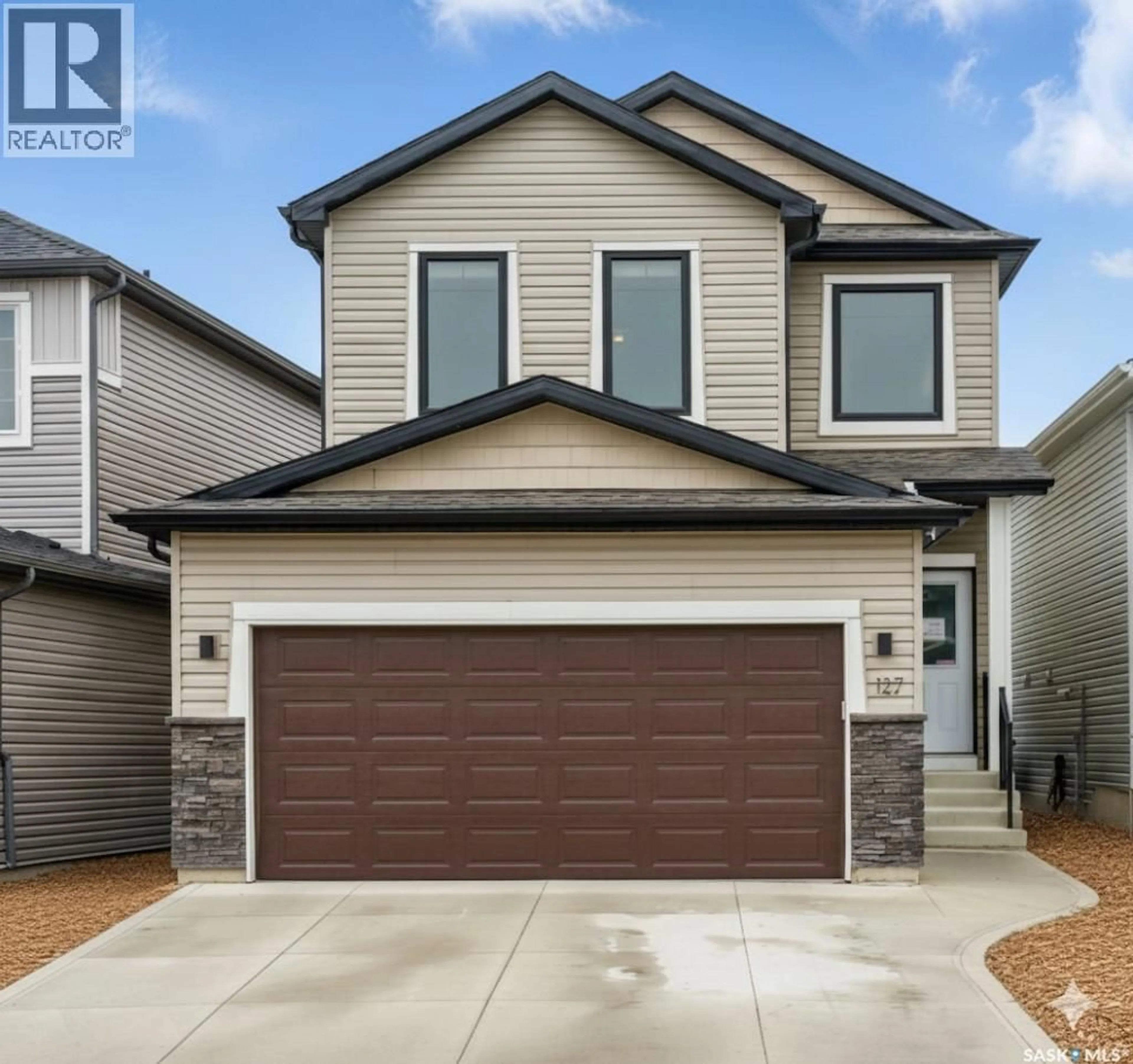 Home with vinyl exterior material, street for 127 BURGESS CRESCENT, Saskatoon Saskatchewan S7V0S1
